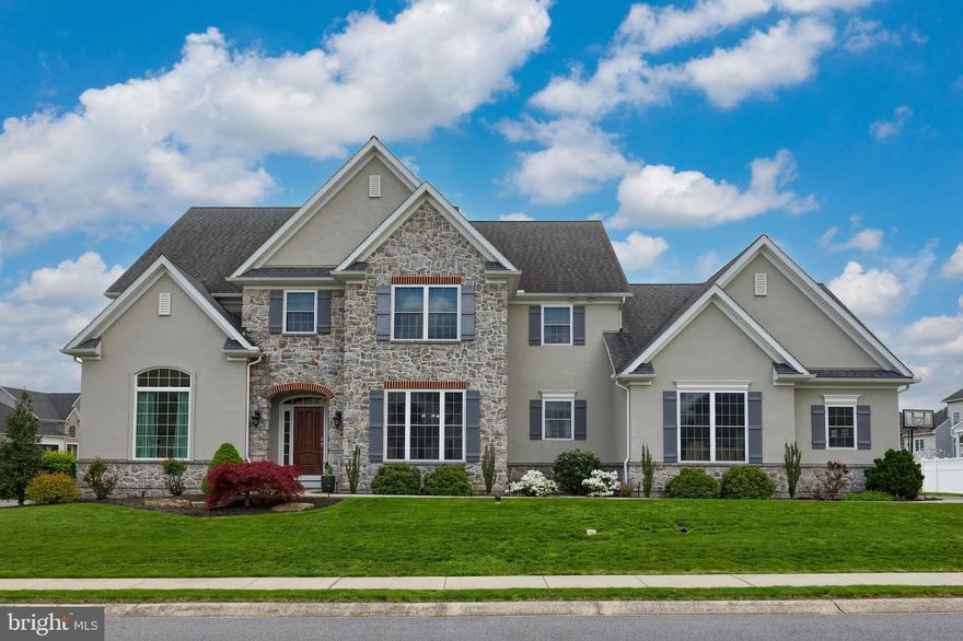 Stunning 4-bedroom, 3.5 bath home located in Manheim Township's Sunset Ridge neighborhood. Flooded with natural light, the open 1st floor hosts an open family room with soaring two story ceilings, an executive office, formal dining room, powder room, mudroom with custom-built cubbies and shelving, bonus 1st floor bedroom with en-suite bathroom and a full service laundry room with working countertop, cabinetry and utility sink. The gourmet kitchen is equipped with upgraded stainless steel appliances, pantry, granite countertops, huge entertainer's island and ample cabinet space. The kitchen's dining area opens to a large covered patio and plenty of room to enjoy the level backyard. Inside a two-story staircase leads to the 2nd floor which features 3 generous sized bedrooms, a huge open loft area and 2 full bathrooms including the primary owners suite which offers two walk-in closets and a luxuriously-appointed bathroom with a tile shower, soaking tub, linen closet, and dual vanity with plenty of storage. The home's unfinished basement provides excellent storage space and offers a perfect canvas for adding additional finished living space. Other finishes include an efficient HVAC system, an oversized garage, graceful moldings, distinct wainscoting, and more. This beautiful home is conveniently located to top-rated schools, healthcare, shopping, parks, and major highways.