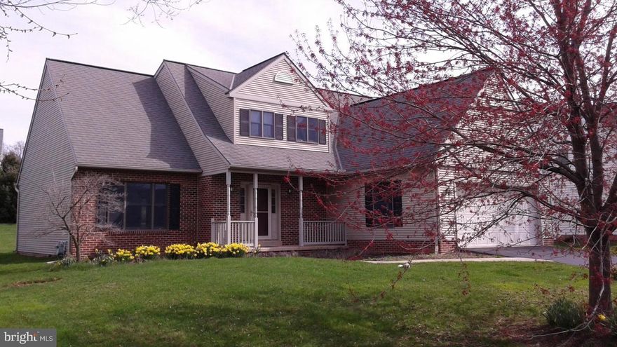Nice brick and vinyl traditional with a cathedral great room ceiling, a first floor owners suite with a Jacuzzi tub, a walk-in closet, first floor laundry room and a bright kitchen/dining area with oak cabinetry. Large basement with ample storage. Fresh paint and new carpet throughout. Nice yard and rear deck. 2 car garage.