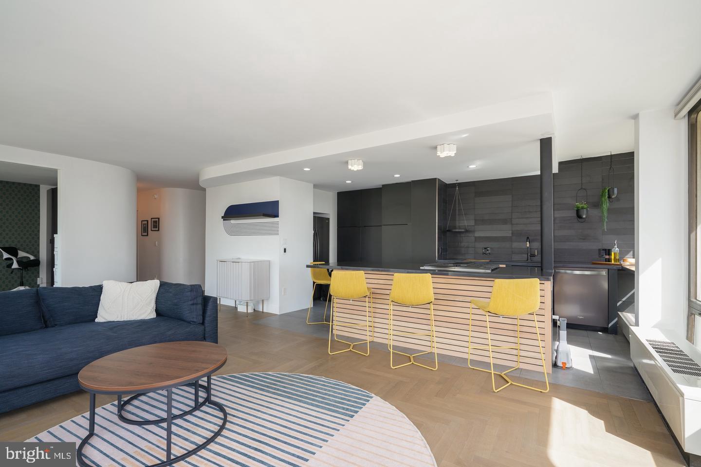 Check out this newly renovated 2-bedroom, 2-bathroom condo in Society Hill Towers. Located on the second floor, this home offers peaceful tree-lined views through floor-to-ceiling windows. It’s a combined unit with an open kitchen that has plenty of storage, sleek black cabinets, stone countertops, a large custom sink, heated floors, and an island with seating for four. Down the hall, the primary bedroom suite is a private retreat, featuring built-in storage, a walk-in closet, and an en-suite bathroom with heated floors, a soaking tub, and a spacious glass-enclosed shower. Other highlights include an in-unit laundry room, solid oak hardwood floors throughout, and custom blinds and built-in closets.For added convenience, there’s underground parking (for an additional fee), bike storage, and a large outdoor swimming pool with grills and locker rooms. The building also offers a fitness center, guest suites, a community room, and additional storage (based on availability).