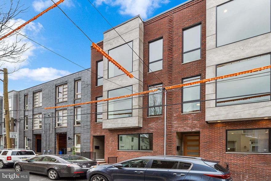 ** 1236 is Pending Sale during pre-construction | 1238 is Pending Sale within 1 week on market ** ONLY ONE LEFT ** Welcome to the development of Oxford Commons, 1236, 1238 and 1240 E. Oxford Street. Introducing three extraordinary new construction homes, located on a quaint street, right in the heart of Fishtown. Rare ** FULL 10 YEAR TAX ABATEMENT ** is offered with these homes. Featuring breath-taking finishes, 2 Car Garage Parking and multiple outdoor spaces. Location. Location. Location. Savor the wealth of restaurants, bars, cafes, lounges, shops, gyms and the entertainment of Frankford Avenue. Take a quick walk over to the waterfront for parks and entertainment. Quick walk to enjoy even more restaurants and entertainment in Northern Liberties and Old Kensington. For transportation: In close proximity to Highway 95, Ben Franklin Bridge, Betsy Ross Bridge, Philadelphia International Airport and the Market-Frankford Blue Line (to Old City, Center City, 30th Street Station, University City, West Philly and Northeast Philly). A private driveway leads you into your generous two car garage. Easily park two cars side by side, with 220 volt line for your Electric Vehicle charger and space. As you enter inside, the first floor boasts 10 foot ceilings. A mudroom awaits with washer and dryer and full storage. Down the hall is a spacious bedroom and a jack n jill full bathroom. Downstairs is a fully finished basement with a bedroom, full bathroom, and a media room/office/ playroom/storage/for your imagination. Second floor greets you towering 12 foot ceilings and marvelous herringbone hardwood floors. The sizeable custom, gourmet kitchen is furnished with walnut or white oak flat panel modern cabinetry, extending up to the ceiling, luxury Monogram appliances, stone countertops, large island, with plenty of seating. The abundance of natural light permeating through the sliding patio doors, allowing you grill outdoors with ease; enjoy your morning coffee, etc. Vast dining and living space allow for entertaining with ease. The living room with oversized windows and gas fireplace is spectacular. The custom steel stringer, oak tread staircase leads you up to the third Floor. The 11 foot ceilings guide you to the bedroom in the rear, great for a home office, gym, nursery, etc. Modern hallway bathroom is adjacent to the bedroom. Yet another laundry room, conveniently located near your luxurious primary suite. Entering into your grand suite, you'll be pleased with 2 walk-in closets, a grand bedroom drenched in sunlight, and a stylish bathroom. The bathroom is furnished with 9 foot double vanity, private toilet closet and an immense walk-in shower with high-end tile selections, dual shower heads, dual rain head and wands for a true spa-like experience. Escape to the vast roof deck, unlike many you have seen in the city of Philadelphia, with unobstructed views of the center city skyline. Buyers are responsible for verifying taxes and square footage. The square footage per plans including the basement is 4,352. Please reach out for the spec package and further details.