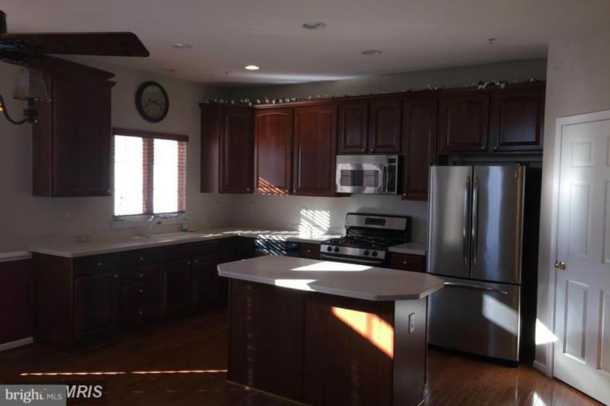 Beautiful end of group brick townhome!Enourmous gourmet Eat-In Kitchen!! leads to deck!! Appliances include: Dryer, Washer, Refrigerator, Stove, Microwave, Dishwasher, Disposal.Amazing Master Suite w/ loft features vaulted ceilingsWalk-In Closet. Also includes a large master bath Tub,Large Family Room off Kitchen with hardwood flooring2 Car Garage! An Easy Walk to shopping.ALSO FOR SALE!!