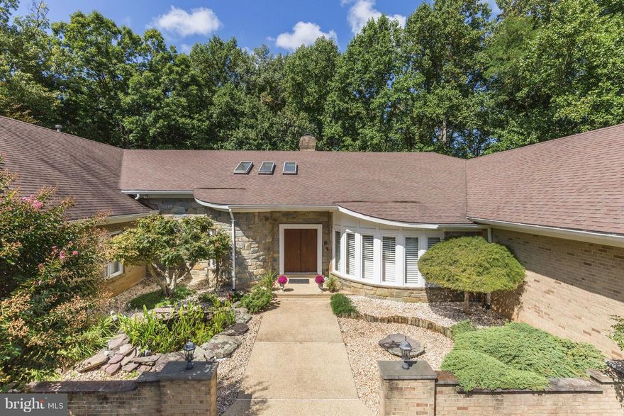 THE VERY BEST VALUE IN POTOMAC. REDUCED $400,000 FROM ORIGINAL PRICE. Luxury living on one level with high ceilings, an open floor plan, skylights, and lots of windows. Enjoyment of the exterior is enhanced wonderful pool and deck and recently resurfaced tennis court/sport court. Additional special features include a koi pond and three car side entry garage. Over 9000 sq. ft. on two levels.