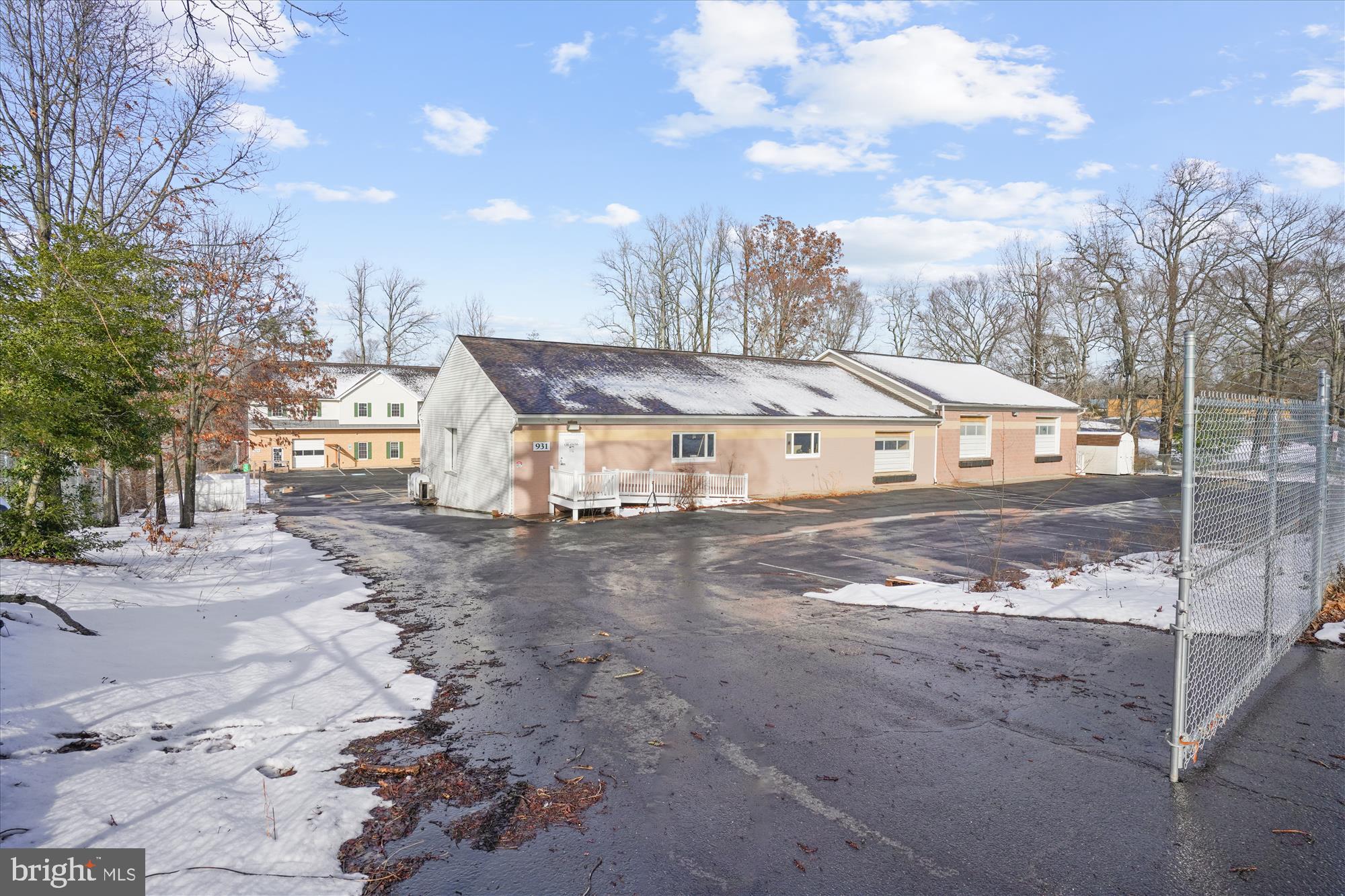 AUCTION! - Hard to find industrial/warehouse to be sold at public auction on Wednesday March 12th at 12 noon. This offering consists of two buildings totaling approximately 17,708 square feet of space and situated on a 1.36 acre lot. The property is zoned I-1 (Light Industrial) which allows for multiple uses including manufacturing and assembly, warehouse, outdoor storage, contractors yard and more.
The front building has 2 large open bays on the road side with 3 loading docks and a restroom. The rear
of the building has 3 large bays each accessed by a roll-up door along with 2 offices and 3 bathrooms.
The back building consists of 2 industrial bays each with a rest room and a roll-up door on the main level.
The upper level is built-out as office space with 5 offices, a conference room, a server room, a large open
work area and a reception. There are 4 restrooms serving this space. The lot has 38 parking spaces and
is fully fenced and gated for security. Can accommodate many different uses and tenants. Roofs on both
buildings were replaced in 2023.
Note: List price is current tax assessment for MLS purposes only. Actual price to be determined at AUCTION!