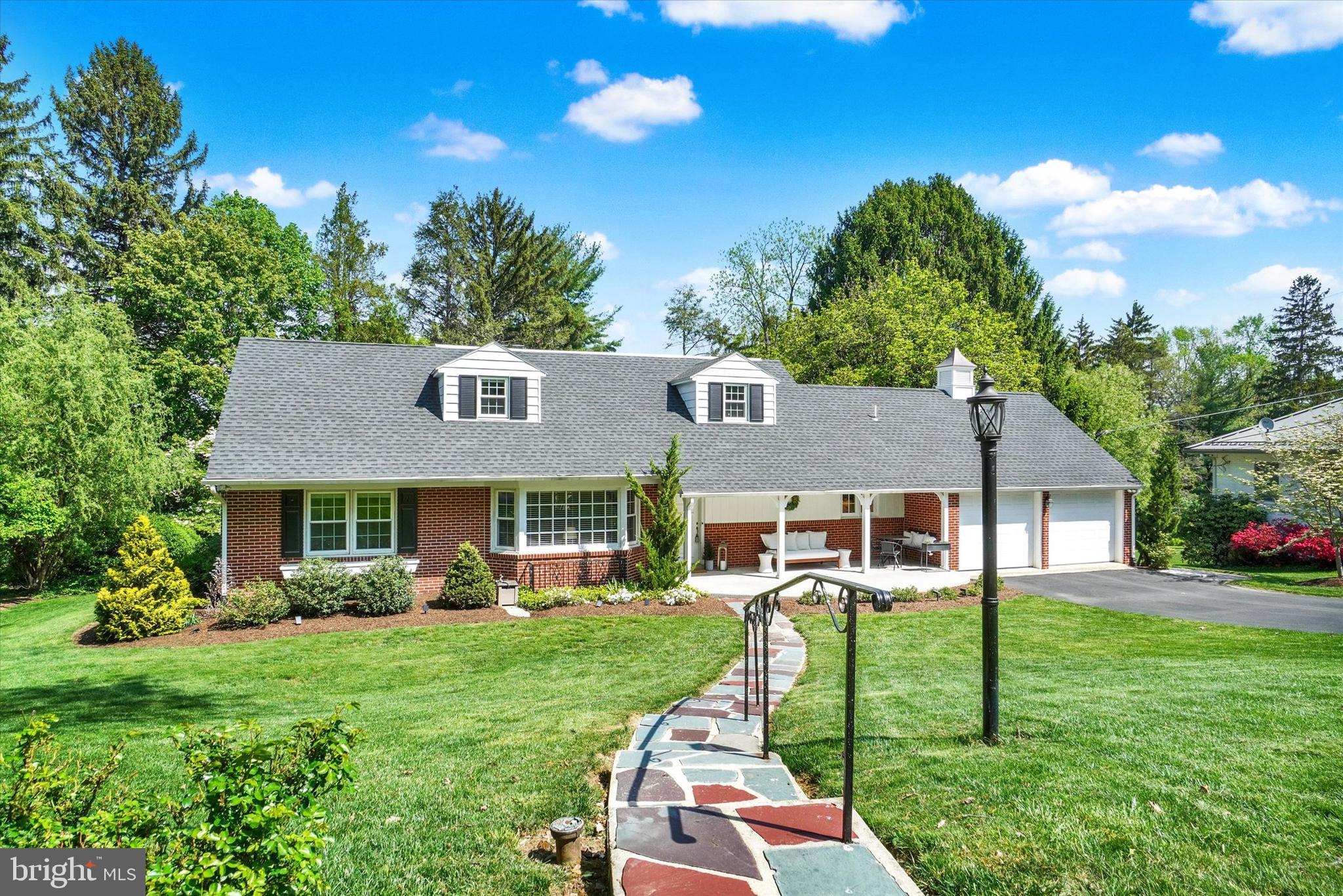 This beautifully maintained 3 bedroom, 2 bath home in Brockie neighborhood boasts many stylish functionality and layout enhancements that perfectly complement its classic charms and architectural character! Unique outdoor features including slate front walkway, circular front porch, and cupola on the roof, add curb appeal and hint at the delights to be found within. Once inside, you will not be disappointed with the many thoughtful renovations that were completed throughout. An impressive 2-story foyer reveals an elegant open staircase and handsome refinished hardwood floors extending throughout the main and upper levels. The modern kitchen features a full array of updated appliances, and a clean, minimalist design with glossy white cabinets, Quartz counters and tile backsplash perfectly emphasized by the contrast of rich tile flooring. Off the kitchen, a recently added covered porch provides a welcoming retreat for your morning coffee, and an easy transition outdoors for warm weather entertaining. The kitchen has also been opened to the formal dining room, for a more integrated and cohesive floor plan. The bright dining room is showcased by a large picture window providing natural illumination and a visual connection with the private back yard beyond. The great room/living room is warmed by a sleek marble fireplace that serves as a striking focal point, with built-ins for your favorite books and games framing a cozy reading area with serene views from a second picture window. The generous first floor primary suite is equipped with a newly updated private en-suite bath offering tiled shower, new vanity, and tile floors. The convenient first floor laundry is just down the hall. Ascend upstairs to find two additional bedrooms and a full bath, skillfully renovated with radiant heated tile floors, double vanity and stylish accents. The larger upstairs bedroom includes custom designed walk-in closet, plus a second walk-in closet for all your shoes, toys or accessories. Downstairs, the finished basement has been redesigned to include a large recreation room flex space or office, and a walk in butler pantry/kitchenette ready for your next gathering, creative project or movie night. Additional space has been created for your home gym, or to add future living space. The attached 2 car garage with ample storage completes this well-designed residence, pleasingly situated on a level lot with lovely landscaping and manicured lawns bordered by mature trees for your privacy. The ideally located community is icing on the cake, just minutes to major medical and college campuses, schools, night life, parks and entertainment. Welcome home!