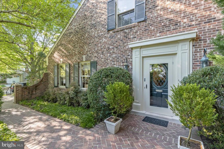 NEW LISTING IN OVERLOOK - WESTMORELAND HILLS, JUST OVER THE DC BORDER! WELCOME TO 4423 BOXWOOD ROAD with water views and a first-floor bedroom (currently used as a library). Set among tree-lined streets, 4423 Boxwood Road is a charming 4 bedroom, 4 full-bath retreat in the heart of the Overlook community with 4306 sq ft of interior space on 3 levels. The home overlooks an expansive open green space maintained by the HOA. The private side-garden entrance opens to a welcoming foyer which leads to the living room with a wood-burning fireplace and French doors leading to the extensive terrace with boxwood, climbing quince, hydrangea and large dogwood trees. The living room flows into an open concept dining room complete with a wet bar, making it an ideal space for entertaining. Next to the dining room is the gourmet eat-in kitchen/family room with a large island, fireplace, built-in cabinetry, a washer and dryer, and water views. This large, light-filled addition also enjoys patio access, creating seamless indoor/outdoor living, a rare find so close to the city! A first-floor bedroom or library complete with custom built-ins offers flexible space for main level living and is adjacent to a full bath and large closet. A single garage with interior entry adds everyday convenience to the main level. Upstairs, a sun-filled primary bedroom with a large ensuite full bath features 3 dormer windows and two large closets. The additional two bedrooms are connected by a full bath. The lower-level features 8-foot ceilings, a spacious living space anchored by a wall of cabinetry, a full bath, a large storage/utility room and an additional closet. With its generous patio, water views, and private setting, this approximately 4,306 SF home represents the “best in class” in this desirable neighborhood with easy access to city living. Overlook is a friendly neighborhood with the conveniences of an active HOA, a private pool, and tree-lined sidewalks for leisurely walks through the quiet streets. Parks and trails are minutes away! The neighborhood is in close proximity to Spring Valley and Westbard Square shops and restaurants, Friendship Heights Metro, the Massachusetts Ave bus line, the Capital Crescent Trail, parks, downtown DC and Bethesda. Westbrook / Westland / BCC schools serve this elegant neighborhood. Showings by appointment only.