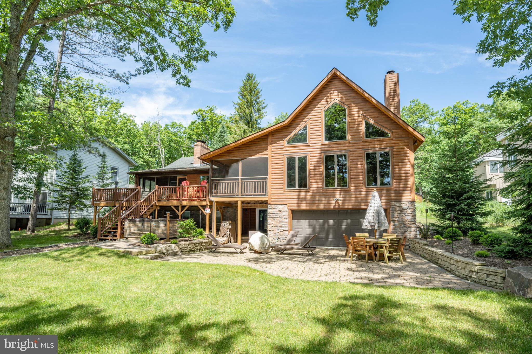 The Rustic Lakefront home you’ve been waiting for! This beautiful log home features an open main level, three levels of living space, 4 bedrooms, attached two car garage with 1 bdrm apartment, screened-in porch area, and so much more! Warm up in front of the fireplace in the main level or lower level, or enjoy the fresh summer air on the lakeside deck overlooking the water. Plenty of space for all of your gear and toys in the attached and detached garage! Outside, enjoy park-like, level lakefront, expansive firepit, and private type-a dock. Rare opportunity in Thousand Acres!