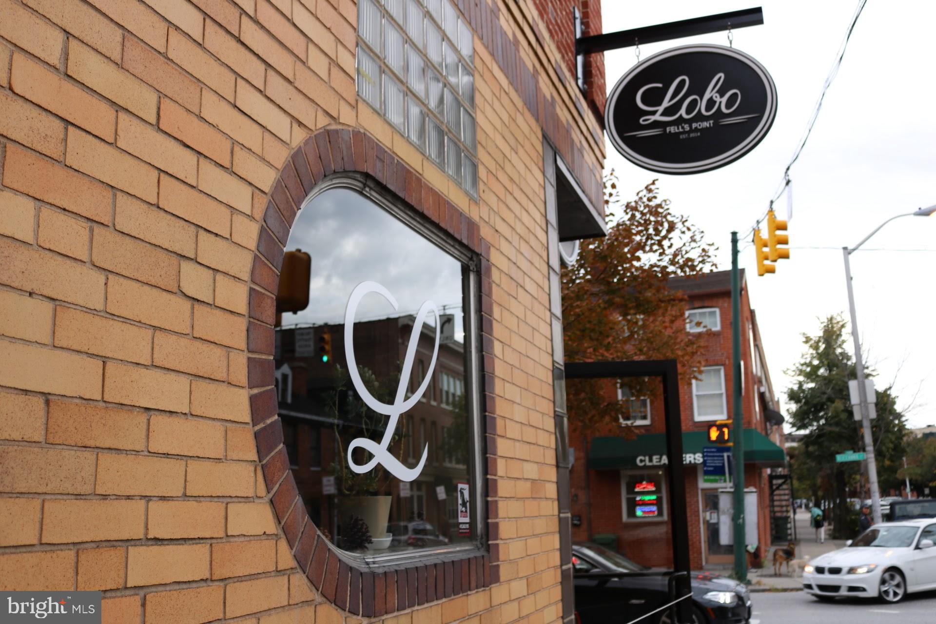 This corner building in the vibrant Fell's Point neighborhood presents a unique investment opportunity. Previously home to the beloved local spot, Lobo, the property is now leased to Mr. Tepache's under a multi-year agreement, ensuring a steady income stream.
Key Features:
Commercial Space: The ground floor features a well-appointed bar and restaurant area, complete with:
- Two restrooms
- An open kitchen equipped with a small hood system
- Fully functional beer taps
- Poured resin floors in the bar and bathroom areas for easy maintenance
- Refrigeration units
- A dishwashing station
Additional Income: The second floor houses two apartments, providing supplementary rental income.
Liquor License: The property comes with a liquor license, adding significant value to the commercial operations.
This property not only offers immediate income through its current lease but also holds potential for future growth in one of Baltimore's most sought-after neighborhoods. The combination of commercial and residential units makes it an attractive option for investors looking to diversify their portfolio in a dynamic urban setting.