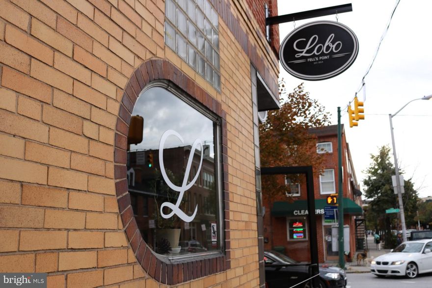 This corner building in the vibrant Fell's Point neighborhood presents a unique investment opportunity. Previously home to the beloved local spot, Lobo, the property is now leased to Mr. Tepache's under a multi-year agreement, ensuring a steady income stream.
Key Features:
Commercial Space: The ground floor features a well-appointed bar and restaurant area, complete with:
- Two restrooms
- An open kitchen equipped with a small hood system
- Fully functional beer taps
- Poured resin floors in the bar and bathroom areas for easy maintenance
- Refrigeration units
- A dishwashing station
Additional Income: The second floor houses two apartments, providing supplementary rental income.
Liquor License: The property comes with a liquor license, adding significant value to the commercial operations.
This property not only offers immediate income through its current lease but also holds potential for future growth in one of Baltimore's most sought-after neighborhoods. The combination of commercial and residential units makes it an attractive option for investors looking to diversify their portfolio in a dynamic urban setting.