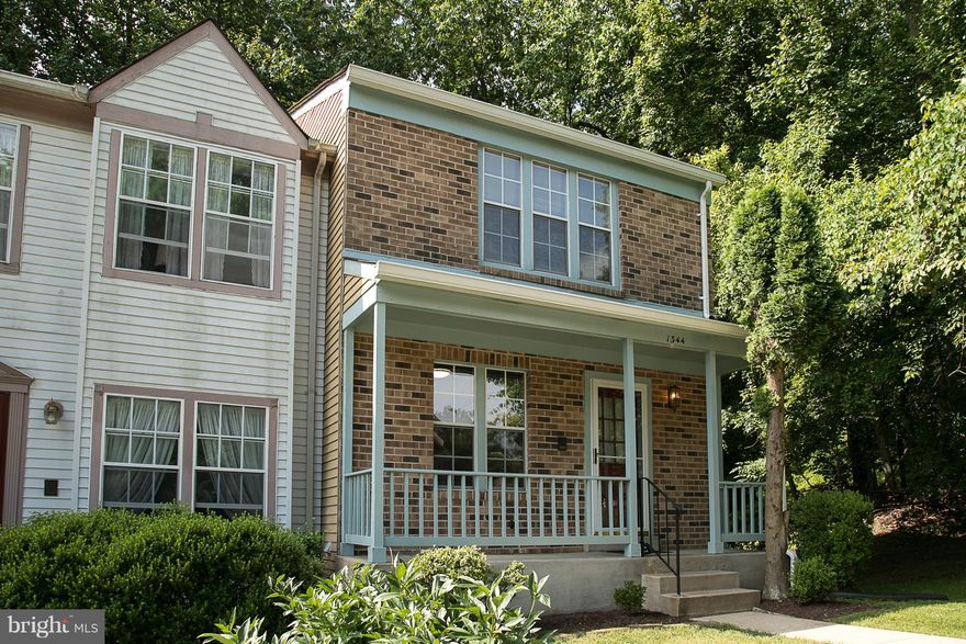 What a beauty. Gorgeous end of group with a very rare full front porch! Meticulously maintained and now new flooring in the foyer and kitchen! Brand new gas stove- Recently added refrigerator and dishwasher. Brand new carpeting throughout. Freshly painted in up to date colors through out! Finished lower level with fireplace and walk out. Big deck overlooking stunning large yard and woods! So Nice!
