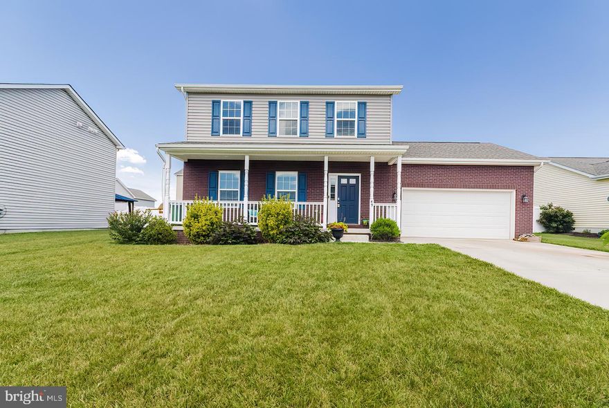 Nearly new brick and vinyl front 3 bedroom/2.5 bath colonial with 2 car garage. Located in one of the few natural gas communities around.  Inviting full front porch leads into main level with 9ft ceilings. Kitchen with SS appliances and granite counters has new ceramic flooring and a new pantry cabinet. Sliding patio doors lead out to concrete patio and back yard. Formal dining room has tray ceiling. Living room and dining room have engineered hardwood flooring. Carpeted upstairs has master bedroom with attached bath, walk in closet and ceiling fan. Other 2 bedrooms are wired for ceiling fans. Laundry is on the bedroom level, along with a full hallway bath.  Bedroom level baths and laundry room have ceramic tile flooring.This comfortable home provides quick, easy access to Rte. 11, Rte. 9 and I-81.