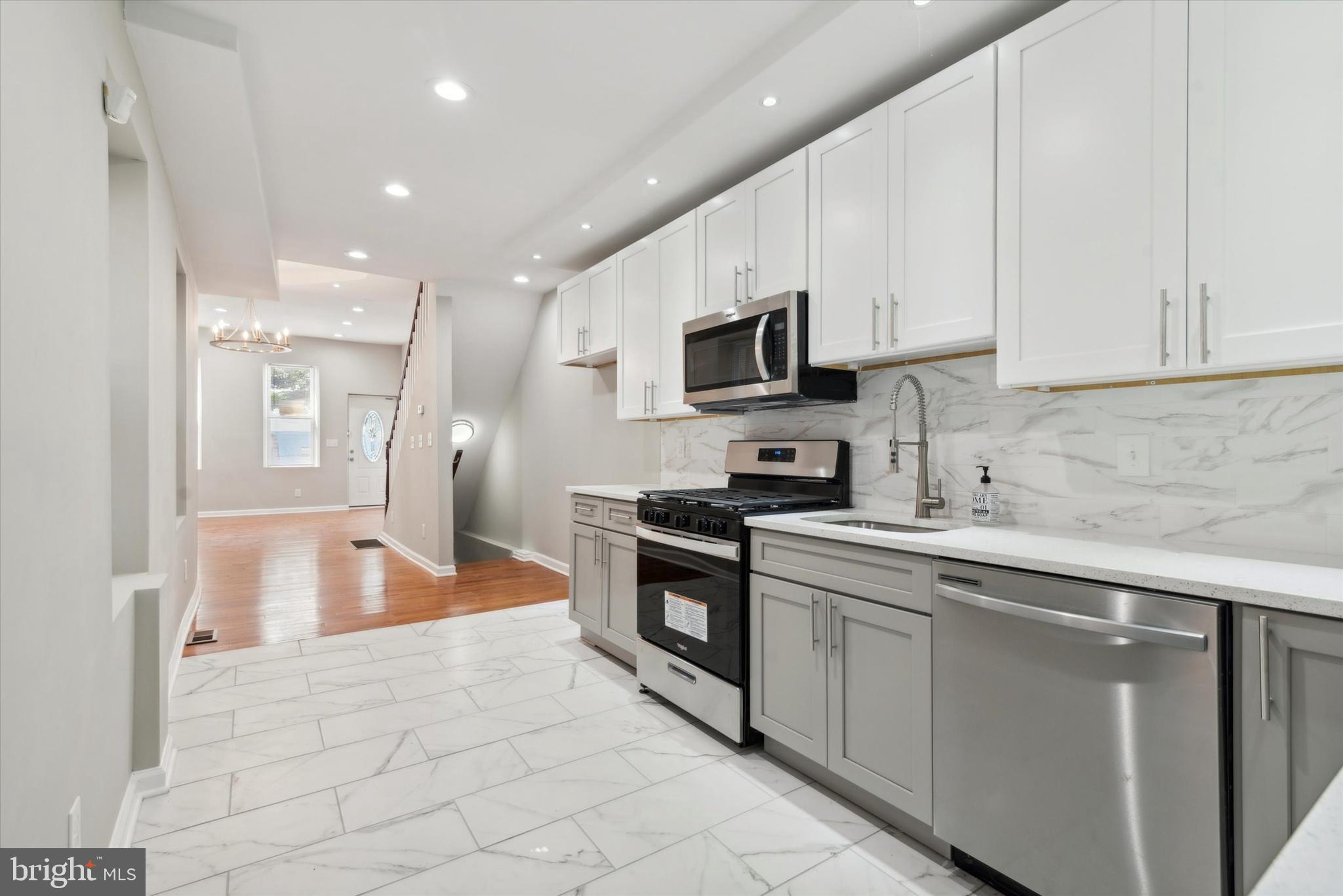 Approved Temple student housing! A smart investor can buy this property just in time to rent to the incoming students. There is a total of five bedrooms and four full baths, tenants share the common living/kitchen areas. Perfect for homeowners or investors, get all the features you want in this renovated home with five bedrooms upstairs and a finished basement with a full bathroom. Completely renovated including new high efficiency heating and air conditioning system, a beautiful new kitchen, four new full bathrooms, all new lighting, new beautiful flooring, new doors and trim, plus the whole house has been freshly painted. Other great features: primary bedroom has a separate bathroom, lots of recessed lighting, basement laundry room. Conveniently located a mere 1500 feet from Temple University. Assistance programs up to $15,000 available towards the purchase of this home for qualified buyers - call for details.