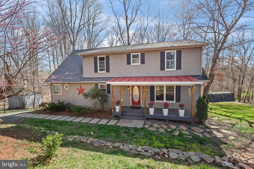 Welcome to your forever home, with a main floor primary bedroom and 10 beautiful acres to grow on! 
  The home features numerous recent upgrades, including a new roof installed in the winter of 2021, all-new energy-efficient windows in 2022 and 2023, and a high-efficiency propane and heat pump AC system added in 2023. The finished basement includes a dry bar and a hidden room, and a new propane water heater was installed in 2022. In 2024, a pond was dug, and all-new kitchen appliances were added. The back porch, which faces southeast, is perfect for enjoying morning coffee while watching the sunrise, and the open field is ideal for evening gatherings around the firepit, with a view of the sunset. The property spans over 10 acres in a horse community, complete with riding trails, a community center, and an established large garden featuring metal raised beds. There is a sizable cleared area at the back of the property ready for animals, and a fresh water spring on the far left, with a creek running along the back of the property, extending 100 feet into the woods.