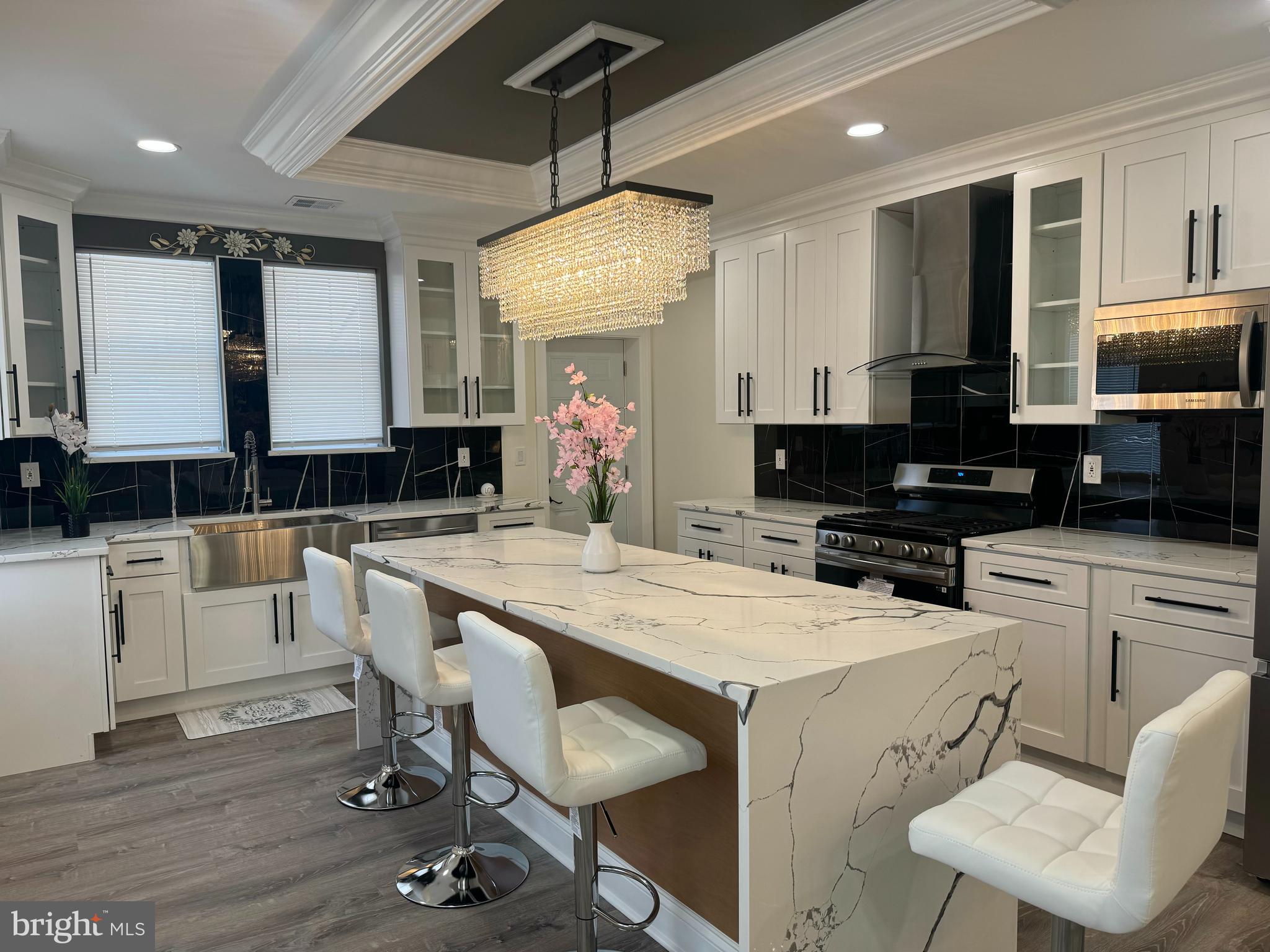Welcome to 5559 Harbison Avenue—an exceptional opportunity to own a beautifully renovated end-of-row home with top-of-the-line finishes throughout. Step inside to an inviting open-concept floor plan featuring stunning vinyl flooring, a custom media wall in the living room with an eclectic fireplace, and a seamless flow into the dining area. The show-stopping kitchen boasts a massive quartz waterfall island, brand-new stainless steel appliances, a farmhouse sink, and direct access to a private balcony—perfect for morning coffee or evening relaxation.
Upstairs, you’ll find four spacious bedrooms with ample closet space and a luxurious full bathroom designed for comfort and style. But there’s more! The fully finished basement offers a second media wall, a full bathroom that has been tastefully renovated, this area has endless possibilities—whether you use it as a guest suite, entertainment zone, or additional living space. Plus, it provides convenient access to the garage. Make your appt today! this property is close to all major highways and shopping malls making it extremely convenient for YOU!