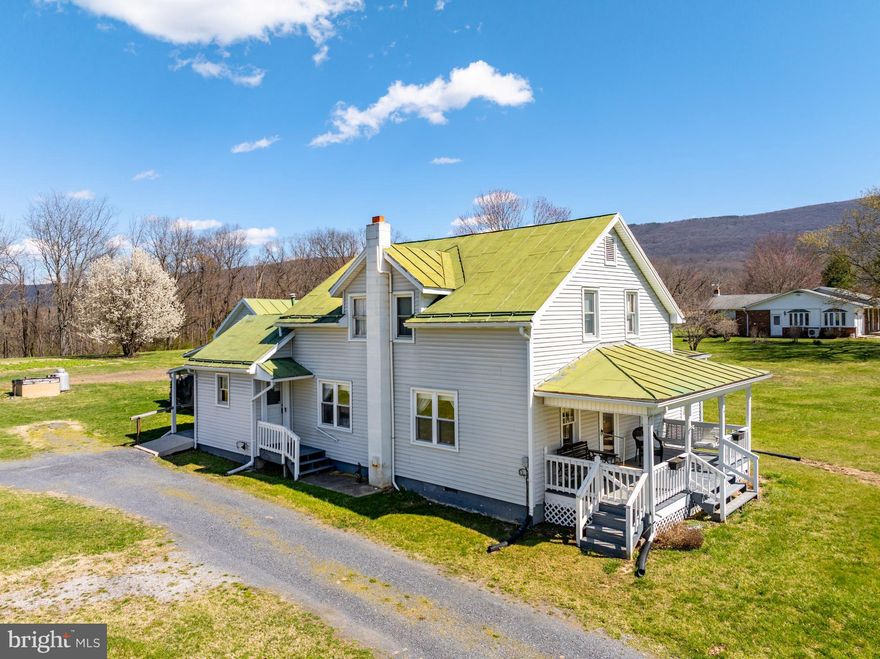 *All Offers are due by 4pm Sunday, March 30th *Charming Country Home on 3.58 Acres with Mountain Views! Nestled in the peaceful countryside, this 4-bedroom, 1-bath home offers 3.58 acres of open space, complete with a barn and attached workshop —perfect for storage and hobbies. The home features a durable metal roof and a lovely enclosed porch, where the laundry area is conveniently located. An attached workshop with upstairs storage adds extra functionality. Inside, the main level boasts a spacious eat-in kitchen that flows into the cozy living room, warmed by a wood stove for those chilly nights. There's also a dedicated dining area, a full bath with a walk-in shower, and a generously sized primary bedroom. Upstairs, you'll find three additional bedrooms, offering plenty of space for family or guests. Outside, enjoy a large yard with stunning mountain views, all while being just a short drive from town and local amenities. Don’t miss this opportunity to own a slice of country charm!