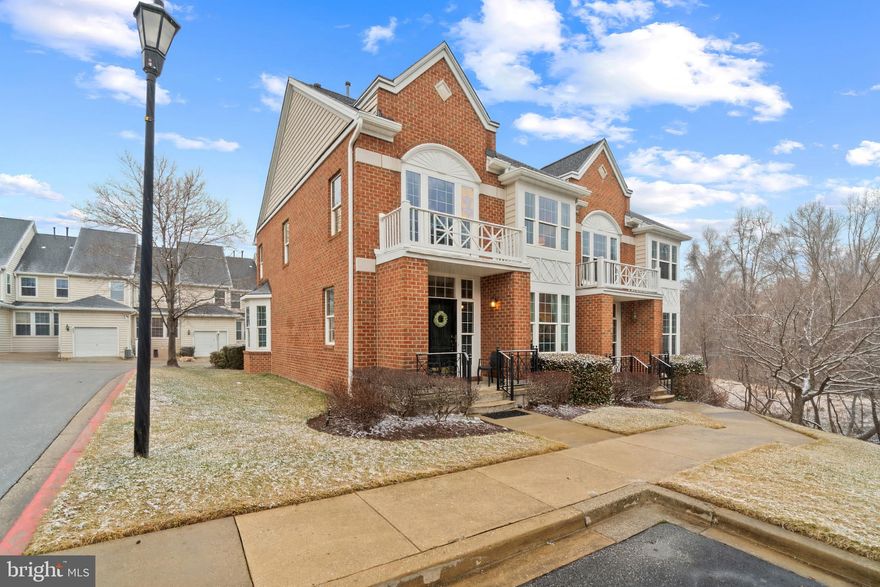 Beautiful end-of-row townhouse built by Beazer Homes offering 3 bedrooms, 3.5 bathrooms, 2,456 finished square feet, and a 1-car garage in desirable Fieldstone. Hardwood floors extend throughout the main level, beginning in the welcoming foyer with a convenient powder room. Just beyond, the home opens to a bright, open-concept living room and formal dining room. Elegant columns subtly define the spaces, while the dining room is enhanced by classic chair rail detailing. Continuing through the main level is the cozy family room featuring charming bay-style architecture and abundant natural light. A breakfast bar connects this space to the well-appointed eat-in kitchen, which showcases rich cabinetry, stainless steel appliances, a custom backsplash, and ample counter space for everyday cooking and entertaining. The upper level includes a hallway laundry closet, three bedrooms with hardwood floors, and two full bathrooms. The spacious primary suite features a tray ceiling, a versatile sitting room ideal for a home office or reading nook, and a beautifully designed ensuite bath with a dual-sink vanity, soaking tub, water closet, and a separate glass-enclosed shower accented by stunning tilework. The lower level provides an expansive recreation room perfect for entertaining, relaxing, or creating a media or game space. This level also includes a full bathroom and storage rooms for added convenience. Outdoor space includes a rear driveway and/or patio area, offering a private setting for outdoor seating or gatherings.