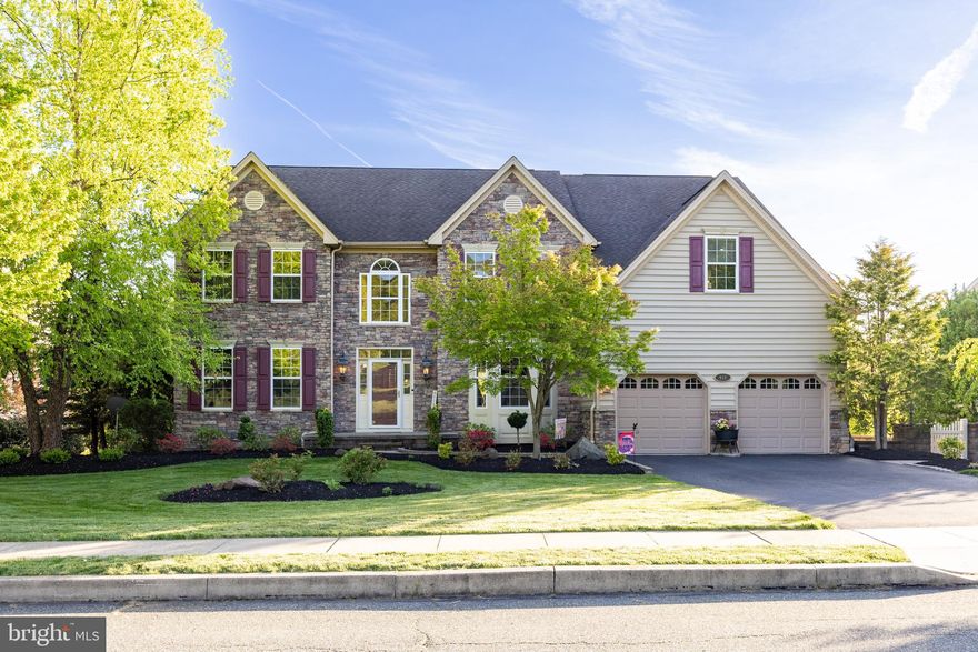 Welcome to 912 Nottingham Road—where space, style, and setting finally come together.  If you’ve been searching for a home that truly has room for everything, this exceptional property, situated on a cul-de-sac street in Coventry Lake Estates within the highly desirable Owen J. Roberts School District, delivers in a big way. As the largest model in the neighborhood, it offers over 5,600 square feet of thoughtfully designed living space. From the moment you arrive, the home makes a striking impression with its stone façade, manicured landscaping, and paver walkway. Step inside to a grand two-story foyer featuring a hardwood staircase and tile flooring, offering a glimpse into the home’s expansive layout. Flanking the foyer, the formal dining room showcases hardwood flooring, a tray ceiling, crown molding, chair rail, and a bright bay window. On the other side, the living room mirrors that elegance with hardwood floors, a tray ceiling, bay window, and custom library shelving complete with a rolling ladder. At the heart of the home, the impressive gourmet kitchen is designed for both everyday living and entertaining. It features a double wall oven, a propane gas cooktop, granite countertops, abundant off-white cabinetry, double under mount stainless sink, center island with prep sink, tile backsplash, a walk-in pantry, and a butler’s pantry with wine storage. The kitchen flows seamlessly into a sun-drenched breakfast room with a cathedral ceiling, skylights, and French doors leading to the deck. The adjoining two-story family room is equally stunning, highlighted by a floor-to-ceiling stone fireplace, a wall of windows, hardwood flooring, and a spiral staircase to the upper level. On the other side of the kitchen, a main-level bedroom offers flexibility for guests or multigenerational living, complete with hardwood flooring, a bay window, double closet, and private access to the deck. A full bath and additional storage right next to the bedroom enhance its convenience. The first floor also includes a powder room, laundry area with cabinetry and utility sink, and access to a side paver patio. Upstairs, the primary suite is a true retreat, entered through double doors and features a tray ceiling and a spacious walk-in closet with custom built-ins. The beautifully updated en-suite bath includes a vaulted ceiling, double vanity set against a subway-tiled wall, a freestanding claw-foot soaking tub, and a large, tiled walk-in shower with frameless glass, dual shower heads, and built-in seating. A private water closet with its own vanity adds an extra level of privacy and comfort. Three additional generously sized bedrooms—two connected by a Jack-and-Jill bath—plus a full hall bathroom provide ample space for family and guests. That’s 3 full bathrooms just on this level alone! The finished walk-out basement expands the living space even further, featuring laminate plank flooring, a built-in wet bar, a propane fireplace with stone surround, and multiple flexible-use areas. Whether you envision a home gym, workshop, office, or additional bedroom, the possibilities are endless. A full bathroom and unfinished storage area complete this level. Altogether, the home offers up to six bedrooms and five full bathrooms. Outside, the backyard is a private retreat with multi-level paver patios, a fire pit, a large elevated deck, and serene lake views. The fenced yard is framed by mature trees, offering both beauty and privacy. The community itself features walking trails and picturesque surroundings. This is more than a home—it’s the space, comfort, and lifestyle you’ve been waiting for.