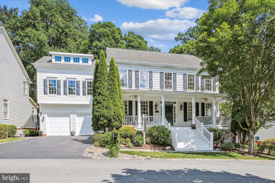 This gorgeous home boasts special features at every turn, a show-stopping two-story accessory apartment, and a spectacular location on a large lot bordered by parklands leading to Muddy Branch Trail. 
The picturesque front porch leads to a main level with large, light-filled rooms and lovely upgrades and updates. The chef’s kitchen boasts granite countertops, a Boos Block topped central island, stainless steel appliances including an extra-wide GE Monogram wall oven with warming drawer, a convection microwave, a decorator backsplash, recessed lighting, and updated hardware. The sunny breakfast area provides a perfect spot to enjoy your morning coffee while overlooking the deck and backyard.
The family room, complete with hardwood floors and a stone fireplace, adjoins the kitchen and breakfast area. Hardwoods extend into the spacious living room and the dining room, featuring a built-in corner cabinet. This level also features a butler's pantry with granite countertops, a pretty powder room, and the laundry room/mudroom with extra cabinet space and a utility sink. The attached garage provides extra storage space (check out the lofted bicycle storage and ceiling hung racks) and the private driveway offers the ultimate in convenience.
The primary bedroom retreat features a double-door entry, tray ceiling, a large walk-in closet and an en suite full bath luxuriously appointed with a glass-enclosed shower, a separate soaking tub, and upgraded tile. Three additional large bedrooms, all with ceiling fans, and a second full bath with a linen closet complete the upper level.
The finished, walk-out lower level is designed for entertainment and relaxation. It includes a daylight recreation/game room area, a media room with a projection and sound system, a bonus room, a renovated full bath with a sauna, a wet bar with an entertainment island, a secret access door to the workshop and plentiful storage space.
Perhaps this home’s most special feature, the custom-designed and built two-level accessory apartment, accessible via the house or a separate private entrance, features creative design elements, custom finishes, and abundant natural light. The main level’s great room boasts LVP flooring and large windows, a full kitchen with granite countertops, custom cabinetry, a spacious pantry, and stainless appliances including a full-size fridge, and a spacious pantry. A beautiful full bath with decorator tile and a laundry room complete this level. A spiral staircase leads to an upper-level with a versatile office area and a big bedroom with roomy closets. Clever storage systems, soaring ceilings, and an overlook to the lower level add drama and interest to this exceptional space.
Outside offers more spaces in which to relax, play, and entertain including the large deck (with a gas connection for your grill) which overlooks a backyard oasis and wooded parkland beyond. The beautifully landscaped, fenced backyard features a meandering stone pathway and a gate to an enchanting garden area that leads to the woodlands and Muddy Branch Trail. 
Located in the sought-after Lakelands community, this beautiful property also offers close proximity to the many amenities and countless dining, shopping, and entertainment options this world-famous neighborhood has to offer.