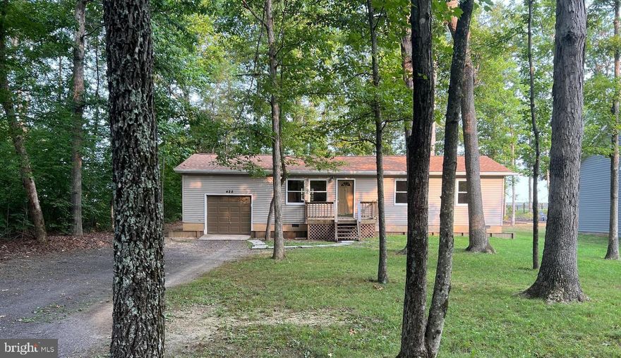 Enjoy this cozy home with crown molding and open concept living surrounded by beautiful shade trees- perfect for cookouts, and private gatherings with family and friends.  There is an extra-large 1 car garage with plenty of storage and a long driveway for plenty of cars. The community offers wonderful amenities including tennis, pickleball, pools, camping, fitness, equestrian and more!