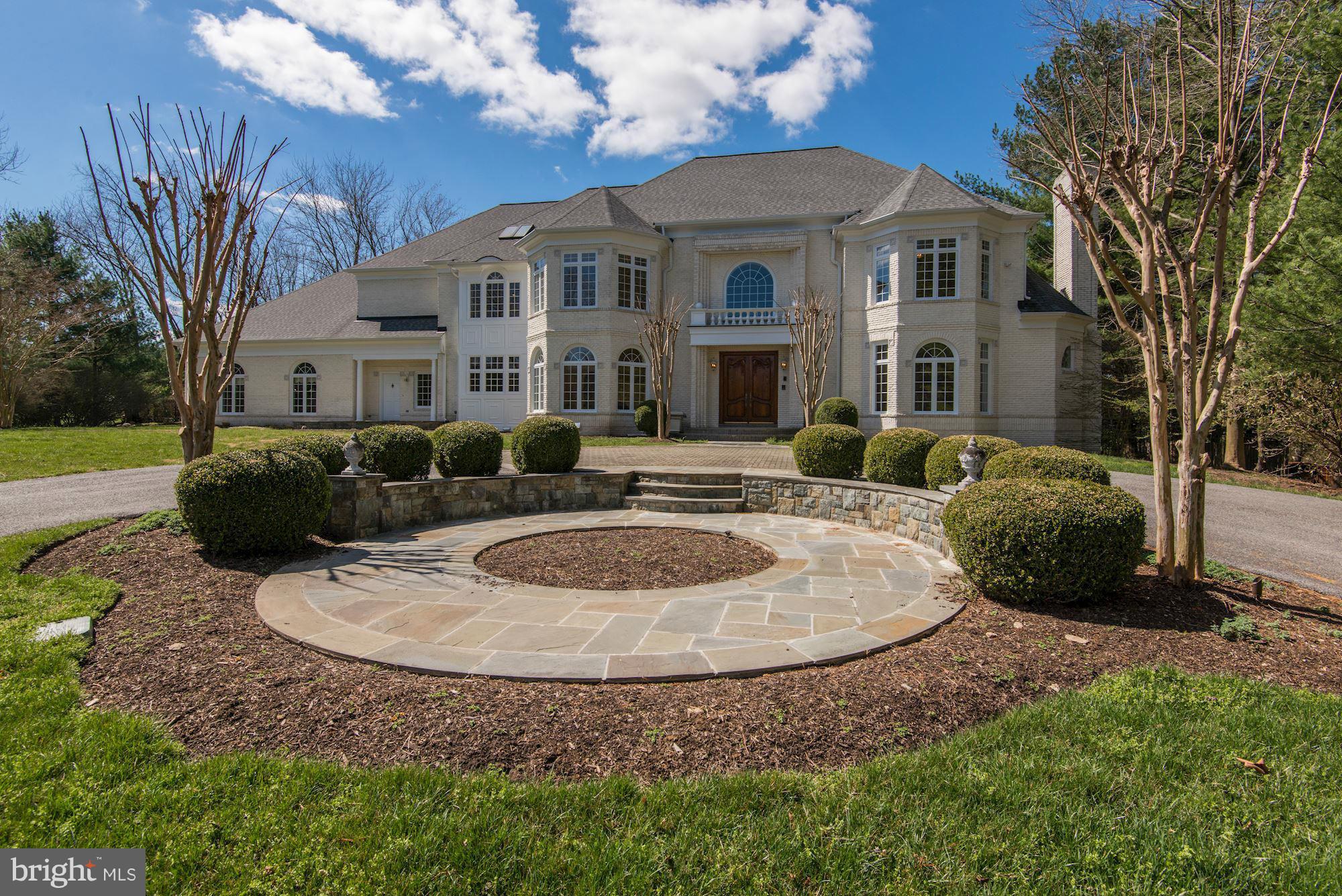 Stunning 12,000SF estate home on two verdant acres just a stone's throw from the Village. Impressive entry hall w/ sweeping staircases opens to a massive two-story family room. Backyard paradise with pool, spa and waterfall. First floor bed/bath suite, library and a 3 car garage. All en-suite bedrooms plus many improvements from the roof to doors and windows, brand new master bath. Pending release