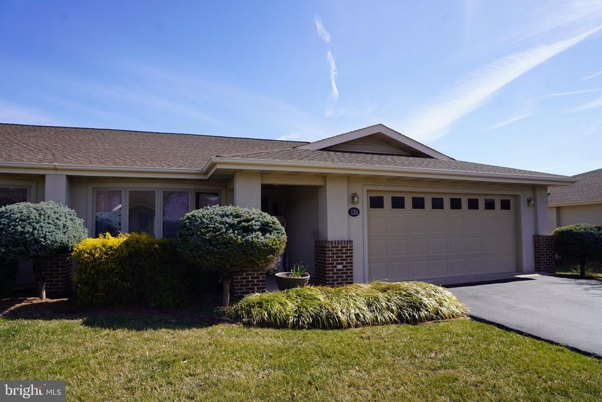 SPECTACULAR AND SPACIOUS TWO LEVEL PATIO HOME! This 4 bedroom, 3 bathroom patio home in The Woods Resort.  This home features beautiful views of the # 3 fairway and pond on the Mountain View Championship Golf Course  from the main floor deck or lower patio area, an open floor plan with 2 skylights, exposed wood beams, vaulted ceilings throughout the main level plus recessed lighting through out.  The stone appointed fireplace with raised stone hearth/wood mantle in the living room.  Attached 2 car garage with attic storage.  Cluster fee of $362/quarterly. HOA fee of $200/quarterly.  Class A (Indoor/Outdoor/Golf) membership dues $2,650 as of March 2023.