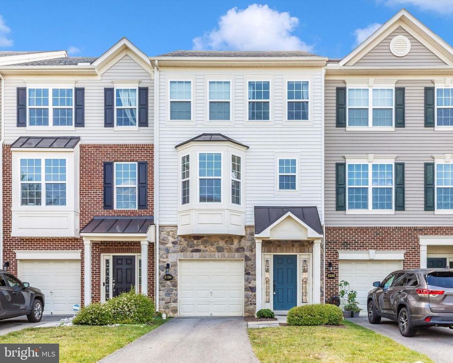 *MOTIVATED SELLERS * Welcome home to this stunning, upgraded townhome offering the perfect blend of comfort and convenience. Step outside to your newly added Trex deck, an expansive outdoor living space complemented by a level, fenced, grassy yard – perfect for relaxation and entertaining. The main level welcomes you with a spacious hardwood foyer, a full bath, and a generous family room that can easily serve as a fourth bedroom. Upstairs, the heart of the home unfolds with a huge great room featuring a cozy gas fireplace and gleaming hardwoods. The spacious eat-in kitchen is a chef's dream, boasting new tile backsplash, a large island, granite countertops, stainless steel appliances, and a walk-in pantry. Retreat to the luxurious Primary Suite with its vaulted ceilings, spa-like bath, and ample walk-in closet. The laundry room is also conveniently located on the bedroom level. Enjoy fantastic community amenities, including a clubhouse and pool, just a short walk away. Ideally situated, you'll be close to all amenities, yet free from city taxes!