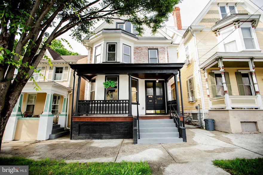 Are you a buyer looking for nostalgia in a home but with all the modern conveniences and much more?  Then this 4 level completely renovated Victorian gem in downtown Martinsburg will meet your dreams and expectations!  Located near the historic area on a quiet street, this home is within walking distance to parks, a library and an elementary school.  This 4 bedroom / 2.5 bath home with wood or ceramic floors has gorgeous original wood trim throughout along with numerous ornate architectural features adding to its charm.  The reproduction tiffany lamps and unique lighting fixtures add to the total ambiance.  The renovation included updating all the plumbing and electricity with all new wiring.  The new HVAC is all permitted energy efficient. Upon entry on the main level, you will find a large living room with an attractive fireplace with mantel and a 3-panel bay window allowing for much natural lighting.  This opens to a formal dining with 2 large windows which in turn leads to the gourmet kitchen.  This kitchen boasts 42” soft-close wood cabinets, stainless steel appliances, a ceramic tile backsplash and butcher block countertops with under the cabinet lighting.  Included in the kitchen area is a coffee/wet bar along with a wooden built-in hutch for added storage.  The convenient butler pantry also includes an area with hookups for a stackable washer and dryer.  Walking out of the kitchen to the large backyard area is a porch for outside enjoyment.  You can’t help but be in awe of the tongue and groove full fence that provides much privacy.  Added amenities to this area is a woodshed and ceramic tile patio. On the next level there are 2 full baths and 3 bedrooms, one of which is the primary with a bay window and a double closet.  The primary bath has a walk-in glass shower and a ceramic double sink vanity.  The top level includes the fourth bedroom and a bonus room both with unique architectural walls, wainscotting and recessed lighting.  Located just blocks from the MARC train station and a children’s museum, it stands near the heart of the vibrant downtown with year-round festivities and great restaurants & shopping.  This location will also give you access to the walking/biking Frog Hollow Trail connecting all the City’s parks, neighborhoods and historic sites.  This trail is currently being built in phases with the first leg now open.  Schedule your showing today!