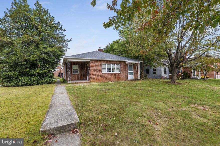 Single Level Living at Its Best!

Welcome home to this charming all-brick rancher featuring a covered front entry and an ideal corner lot setting. Step inside to discover bright, single-level living filled with natural light and timeless appeal. The spacious great room showcases beautiful hardwood floors and a cozy wood-burning fireplace, creating a warm and inviting atmosphere. Enjoy the wonderful enclosed breezeway connecting the home to an oversized two-car garage—a perfect spot for morning coffee or casual gatherings. The home offers three generous bedrooms, a well-maintained bath, and a layout that’s both comfortable and functional. Exceptionally clean and move-in ready, this home is conveniently located near major commuter routes, shopping, and dining. A perfect combination of classic charm, comfort, and convenience—you’ll want to see this one in person!