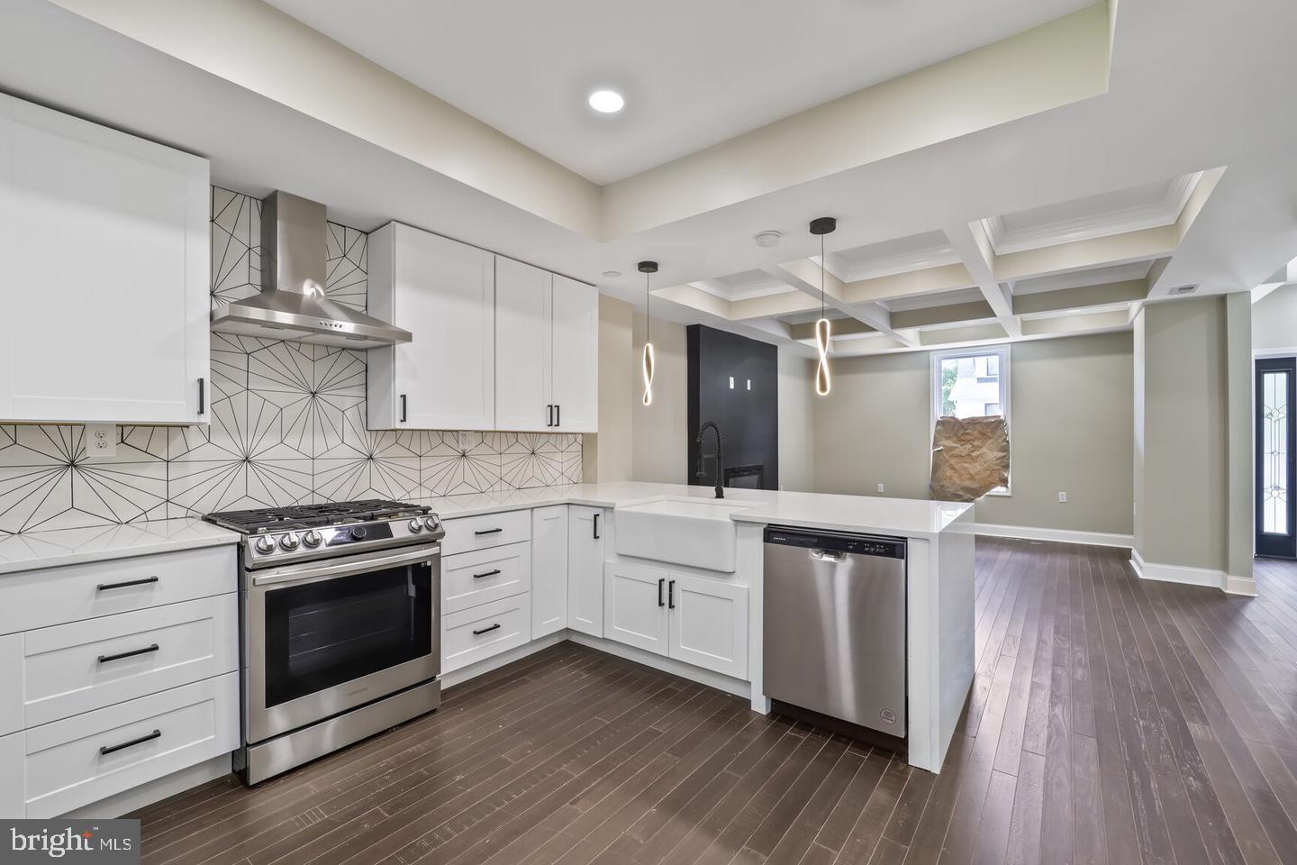 Stunning, Fully Renovated Colonial in Sought-After Mount Rainier – A Rare Find! This beautifully reimagined 3-bedroom, 2-bath home has been fully renovated from top to bottom and offers an open, sun-drenched floor plan with exquisite designer finishes throughout. Highlights include gleaming hardwood floors, elegant coffered ceilings, and a brand-new gourmet kitchen featuring stainless steel appliances and stylish cabinetry. Both bathrooms showcase masterful tile work and modern fixtures. Enjoy peace of mind with all-new HVAC, roof, cabinets, and more. The fully finished basement provides extra living space, and the spacious deck is perfect for entertaining. This is a rare opportunity you won’t want to miss—a true must-see!