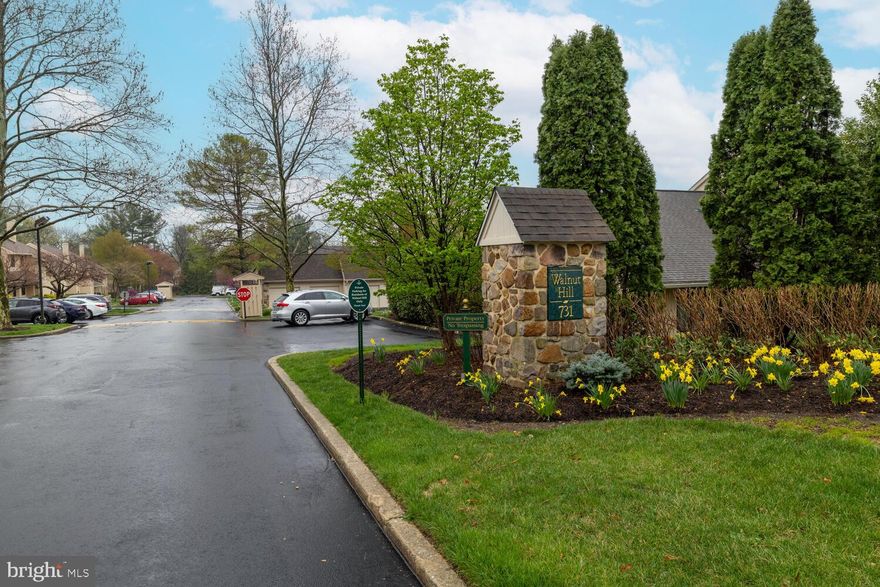 This bright, spacious end unit in the beautifully maintained Walnut Hill community offers a flexible layout and an unbeatable Ardmore location. The home is thoughtfully designed across two levels and features abundant natural light, large windows, and generous living spaces. A full basement and a garage (with it's own parcel #) are included in the sale.

The open-concept kitchen flows into the expansive living room, featuring an island with seating, ample cabinetry, and a sliding glass door that leads to a second private patio—perfect for morning coffee or evening gatherings. The living room boasts cathedral ceilings, a floor-to-ceiling stone fireplace, and natural light from large windows.

The first floor includes a primary suite with an en-suite bathroom with a beautiful walk-in shower. This room also has a private patio with a sliding glass door and a large walk-in closet. A second generously sized bedroom, a full hall bathroom with a tub, and a separate laundry area complete the main level.

Upstairs, a loft overlooks the living area and provides a versatile space that can be used as a home office, reading nook, or additional lounge. There's also an additional bedroom and a convenient powder room on this upper level.

A full unfinished basement offers excellent storage or future potential, and a private garage—deeded under a separate tax ID—is included in the sale.

This home offers the best of Main Line living in a peaceful, well-landscaped community and just minutes from Suburban Square, parks, dining, shopping, and regional rail access.