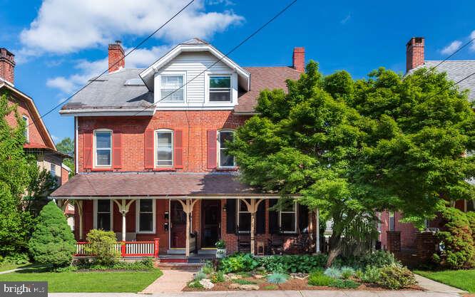 Beautiful Brick Townhouse on one of the borough's best streets. This 3 bedroom, 2 full bath home has it all. Enter into a classic long hallway with striking refinished wood floors. High ceilings, wood trim, and curved archways. The first floor consists of a den, living room, remodeled kitchen, and dining room. The dining room has exposed brick and is as charming as it gets. The kitchen has quartz counters, under the cabinets lighting, and stainless steel appliances. The second floor is just as amazing as the first. The owner remodeled a rear bedroom into a second full bath. The main full bath has been remodeled with tile flooring, modern fixtures, and a claw-foot bathtub. Three bedrooms round out the rest of the home. Great covered front porch. Rear-covered deck. Rear-covered patio with pergola. The rear yard is fenced. Relax to the sound of a small flowing man-made waterfall. The 2-story rear garage does need some TLC. Gas FWA. The owner has remodeled the kitchen, installed new windows, remodeled the bathroom, added a full bath, installed new flooring, refinished hardwood flooring, painted the interior, and added a barn door since moving in. Amenities such as the refrigerator washer (newer) and dryer are included. Ductwork has been added so all of the hard work has been completed. All you need is just the hardware for AC. Come enjoy borough living. Festivals, restaurants, small businesses, parks, and trails, community are all waiting for you.