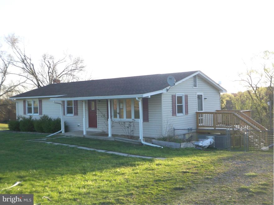1604 sq. ft Ranch home with a welcoming front porch.  First floor offers a new side deck, updated kitchen, living rm, dining rm leads to a large deck, 3 bedrooms, with hardwood floors throughout. Spacious unfinished basement with half bath.  This home offers a new heat pump and a new roof.  Fenced side yard and ground level patio.  Property on private septic public hook up is available.
