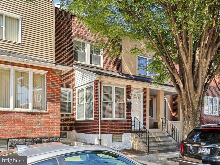 Tucked away on a tree-lined street in the sought-after Marconi Park neighborhood, this 3-bedroom, 1.5 bathroom townhome boasts modern updates with classic city charm.
Step inside from the cozy enclosed porch to discover a sunlit living space with hardwood floors that flow seamlessly into the dining area and an impeccably updated kitchen. Designed with the home chef in mind, the kitchen features sleek stainless steel appliances, a gas range, and stylish finishes that make both everyday meals and entertaining a joy.
Upstairs, you’ll find three comfortable bedrooms and a renovated full bathroom, giving everyone their own retreat. The fully finished basement adds even more living space, complete with a convenient powder room—perfect for a home office, media room, or play area.
When it’s time to relax or gather with friends, step out to the spacious rear deck, an ideal spot for morning coffee or weekend BBQs.
Living here means more than just a home—it’s a lifestyle. Enjoy being within walking distance to Marconi Plaza, FDR Park, and all the neighborhood’s favorite restaurants and cafés. With the stadiums, casino, Broad Street Line, and Center City just minutes away, you’ll have unbeatable access to everything Philadelphia has to offer. Street parking and a strong sense of community make it easy to settle right in.
Whether you’re a first-time buyer ready to put down roots or a growing household looking for more space, this Marconi Park gem is ready to welcome you home!