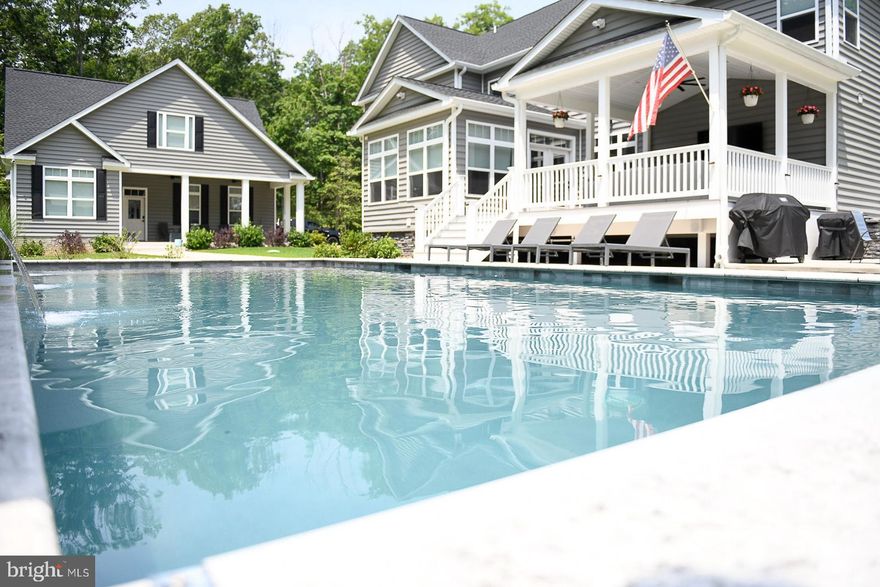 Luxury, Space, and Sophistication – All in One Remarkable Property! Prepare to be impressed by this meticulously maintained almost 7,000 sq ft estate—a rare gem that blends luxury, comfort, and functionality in every detail. If your current home lacks character or space, this extraordinary residence will exceed all your expectations! Interior Highlights: • Gourmet Kitchen with oversized island, walk-in pantry featuring a second island and refrigerator • Wet bar/Coffee station and recessed lighting throughout • Main-level office with custom built-in desk and counters • Spacious dining room and large breakfast area perfect for gatherings • Stainless steel appliances and cozy propane fireplace •Under cabinet lighting • Cat 6 wiring throughout for seamless connectivity and hard wired ethernet cables in every room• Wifi access point on every floor •Laundry rooms on all three levels for ultimate convenience • Two staircases provide easy access to the second floor Owner’s Retreat: • Expansive Owner’s Suite with a massive walk-in closet featuring an island with built-in cabinetry • Spa-like ensuite bath with rain shower head, dual sprayers, and tiled ledge Bedroom Features: • 6 spacious bedrooms, 5 equipped with custom closet organizers Entertainment & Lifestyle: • Sunroom leading to a covered porch—perfect for year-round relaxation • Theatre room with projector, 7.1 surround sound with 150" screen and projector and bar in the basement • 20’ x 40’ chlorinated pool with a 9” deep sundeck, automatic cover, and expansive patio • Blink security system with cameras and spotlights and alarm contacts and glass break sensors • Safe area under front porch • Stunning foyer chandelier that makes a grand first impression Garage & Storage: • Oversized gutters with leaf guards  •Attached 3-car side load garage with remote door openers • Detached 42’ x 38’ garage/workshop—ideal for storage, hobbies, or a man cave with 960 sq ft of conditioned space  Bonus Features: • Fully insulated floors and interior walls for sound control •Tankless water heater & whole house dehumidifier• Full 18-zone yard irrigation system • Gutters piped underground • Includes an additional 4+ acre lot—a rare opportunity to expand or enjoy added privacy This home truly has everything—and it’s all been immaculately maintained. Private showings available by appointment only with a minimum of one hour notice.