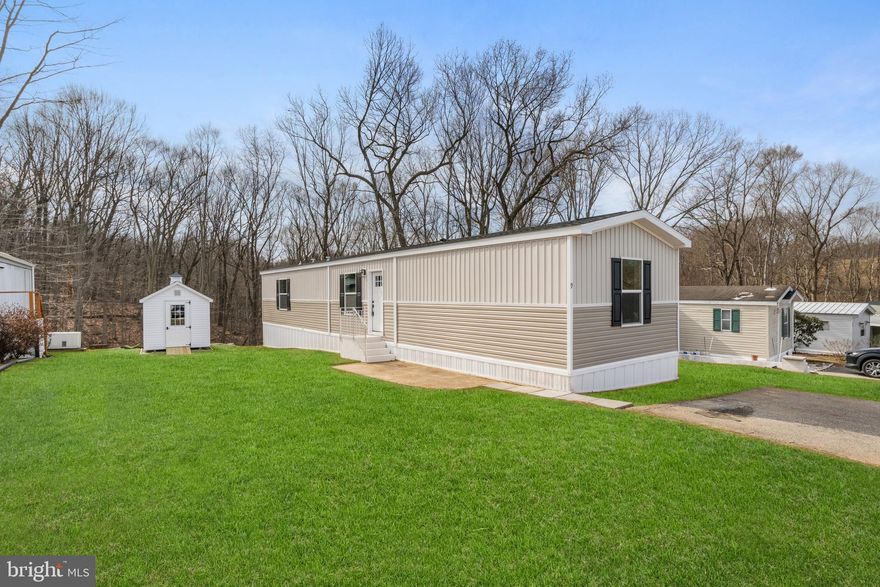 ***Seller bought this home directly from the manufacturer at dealer cost.  Home is being sold below cost in an effort to fill the empty lots in the mobile home community.
Welcome to your brand new mobile home in the Margaretta MHP Community! Nestled in a beautiful and secluded location within the Eastern York School District, this home offers both privacy and convenience. As you step through the front door, you'll be greeted by an open layout that creates a spacious and inviting atmosphere. The kitchen boasts tons of cabinet space, tastefully designed to accommodate all your cooking needs. The living room features an accent wall, adding a touch of charm to the space. With 3 bedrooms and 2 bathrooms, there's plenty of room to relax and unwind. Plus, washer dryer hookups make laundry day a breeze. This home is E Built, which means it is 30-50% more energy efficient then other manufactured homes. Insulation, Energy Star appliances, specialized water heater and windows all contribute to its energy efficiency. This home is also Zero Energy Ready which means it can be connected to solar or wind easily. Outside, you'll find a brand new 8x10' Stoltzfus A Frame Shed with Cupola included with the home, providing ample space for all your storage needs. One year limited home warranty included with the sale. Don't miss out on the opportunity to make this beautiful mobile home yours. Call today to schedule a tour! ***Each home has two parking spaces available.***