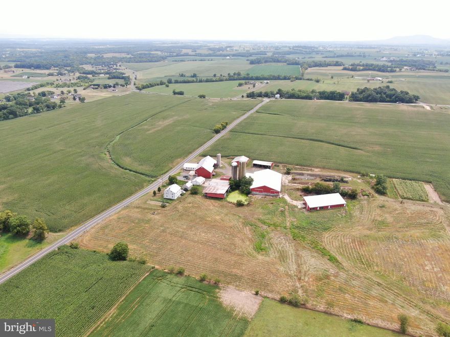 EXCELLENT 115+- ACRE HIGH PRODUCING FRANKLIN COUNTY, PA FARM! This farm lays nice and is nearly all tillable. The farm features a beautiful well maintained home with a nice side porch to sit and enjoy the views of the farm. There is also a small limestone home in need of TLC. Farm buildings include a 26x31 oversized 2 car garage, 44x94 bank barn over a 14x42 wagon shed 39x41 stall with center feed bunk and 34x100 stanchion also with a concrete barnyard, 60x60 steel frame equipment shed/overhang, 33x70 equipment shed/overhand, 18x30 shed with concrete floor, 48x48 garage/workshop, 40x64 open equipment shed, 18x22 milk house with 1,000 gallon Mueller milk tank and stainless steel sinks, Mueller Model OE cooling and cleaning system, and Westfalia Systemat deluxe pipeline washer, 18x29 double six milking parlor with westfalia systemat metatron 12 metering units, 75 stall 80x100 free stall barn with center feed bunk w/ 64 headlocks, Ritchie Automatic waterer, and grooved contrete floors, 40x100 heifer barn w/ 48 headlocks and a Ritchie automatic waterer, 3 stave silos 20X72, 16x60,  10x50, 175,000 lagoon. This farm is in farm preservation. This property will be offered at auction on Friday September 22, 2023  @ 1:00pm. List price in no way represents minimum, starting, or acceptable bid. It is used only as a guide to find the property.