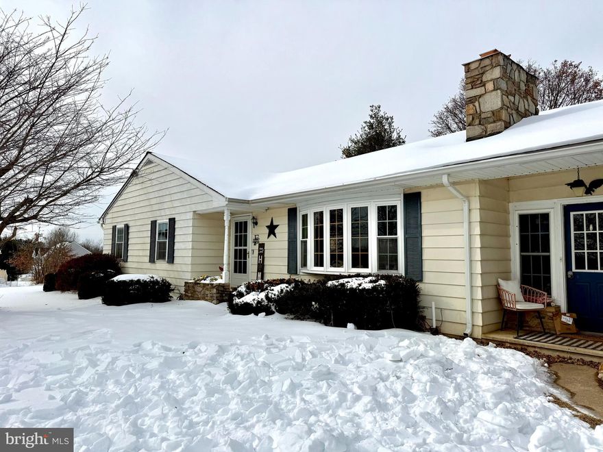 This charming and updated rancher sits on a flat 1-acre lot and offers space, flexibility, and peaceful country living. From your living room window, you can view the sweeping landscape of rolling cornfields. The main level features a large kitchen with ample cabinetry and counter space and a separate dining area for a large table. Spacious living room with bay window, incredible natural light, a beautiful stone fireplace with built-in cabinetry, along with a trimmed coat and shoe area near the front entrance, adding both charm and function. 3 sizable bedrooms and a full bath with meticulously maintained original details. The main level bathroom has an added bonus... a washer/dryer hookup if you prefer laundry upstairs. The recently renovated lower level includes new carpet, recessed lighting, and fresh paint, plus a 4th bedroom and 2nd full bath, ideal for guests or extended living. There are 3 fireplaces total throughout the home. Additional highlights include a one-car attached garage with EV hookup, mudroom with interior access, rear stone patio, and 2 detached garages perfect for a workshop or (car) storage. 

Ages of Systems/Seller Updates: Water heater (2025); Refrigerator, Stove & Dishwasher (2024–2025); Basement remodel w/ professional asbestos removal (2023); Roof (2016); Gutters (2022); AC (2021); Chimney liners (2021); Water tank & well pump (2016); New Sediment Filter (2205); Septic pump scheduled for 2/7/26.

*Home is in the Westminster HS Zone!**Professional photos will be uploaded once received on Thursday. Showings will begin Thursday at 3 pm!*
