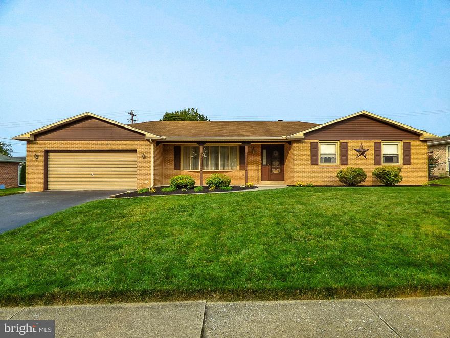 Location, location, location!  This full brick rancher in Haines Acres is located on a perfectly level lot with mature hedges around the back for superior privacy!  Check out the freshly manicured landscaping, the full front porch, the 10 x 20 rear concrete patio with a patio roof & the large finished 2 car garage.  This home has 3 bedrooms & 2 full baths, a large front facing living room, a large family room with a wood burning fireplace & 2 skylights, all new replacement dual pane double hung windows with screens, a large eat in kitchen & a separate dining room.  This home has a full unfinished basement with a lighted cedar closet, a separate storage room & drylock painted basement walls.  This home even has skylights in the family full bath.  This home is extremely clean & well kept, close to I-83 & Route 30, only blocks away from 4 grocery stores, multiple restaurants, located in York Suburban Schools & a short walk to the park & the middle school!  Hurry - this great home will be sold before you know it!