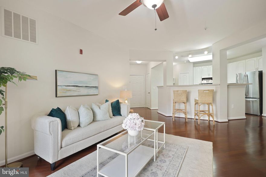 Luxury living in this gorgeous Legato style condo, boasting sun-drenched interiors and open concept living spaces! Step outside to enjoy a spacious, covered deck, overlooking the landscaped courtyard-perfect for enjoying your morning coffee! The expansive kitchen features white cabinets, modern backsplash, stainless steel appliance (2021), and center island! Spacious owner's suite with oversized walk in closet and gorgeous attached bath featuring full-sized shower, double sink vanity, and relaxing soaking tub! Second bedroom features a walk-in closet and attached dual access bath! Plentiful updates include freshly painted interiors, updated hardwoods, new carpet in primary bedroom, hot water heater (2015)! Amazing amenities include a community pool, office area, Cyber Cafe, movie theater, library room, rooftop tennis courts, fitness center, and concierge service for security and package delivery! The deeded garage parking space is only steps away from the unit, making it a breezy walk to and from your car! Just steps to the fine dining, shopping, and entertainment of Hunt Valley Town Center, and easy commuter access to I-83 or the nearby lightrail station. Outdoor enthusiasts will love the bike racks in the garage and the proximity to the NCR Trail. This home checks all the boxes!