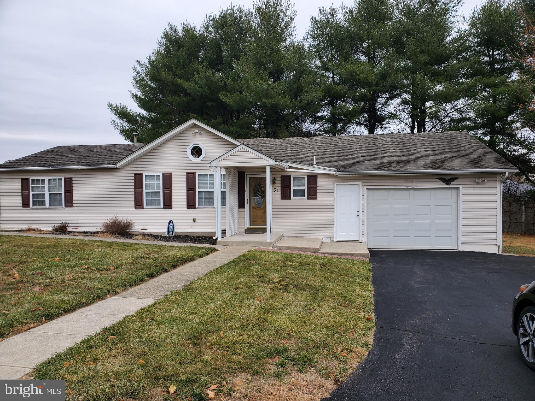 Nice rancher is away from traffice and accessable by a semi private road that leads only to a few houses spaced enough apart.  There is an padio around back and land around all four sides.  This well maintained home also has a back up generator.  The address is 31 Rear which is not visible from Bridgetown Pike. It is not to be confused with 31 Front which is a taller and older building near the road.