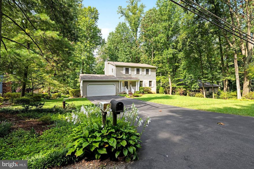 Amazing opportunity on this lovely colonial on one of the best lots you've seen in a long time*Main level FR w gas FP walks out to custom, two-tiered deck overlooking over 1/2 acre of flat lot with trees and sun*large LR/DR & Eat-in Kitchen*walk-out lower level with 1/2 bath and huge laundry/workshop space*4 br/2 full bath upper level with all great-sized bedrooms*master suite with ample closet space & custom shelving*replaced double-pane vinyl windows*Generac whole house backup generator*two car garage with epoxy-painted floor and lots of garage storage options*front brick walkway along large, flat front yard*replaced architectural shingle roof*walk to VRE*close to all things Burke/Springfield