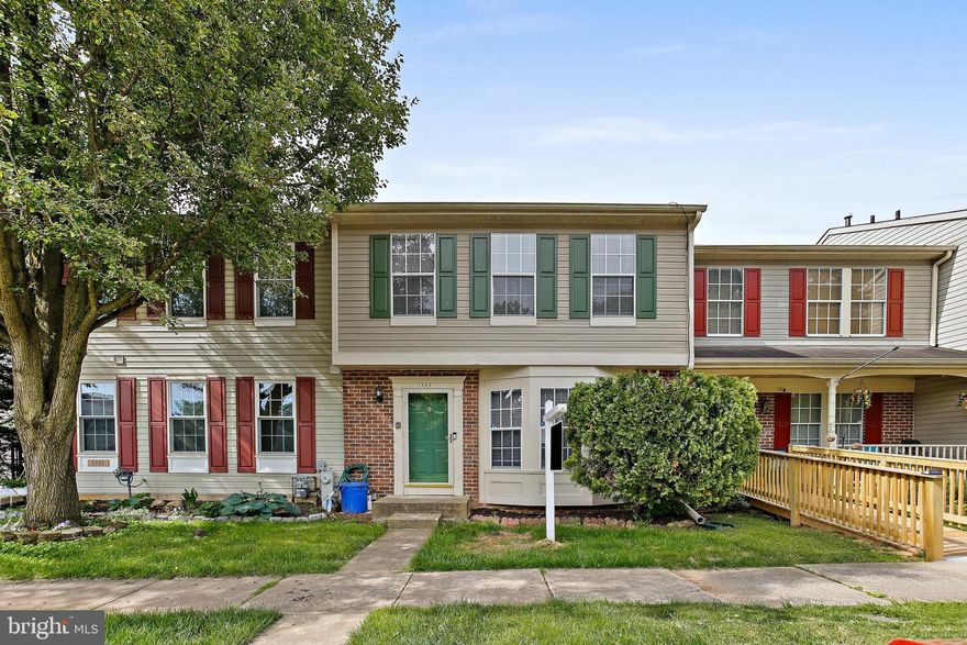 Welcome to this beautifully maintained townhome in the desirable Castle Stone at White Marsh community. This spacious 3-bedroom, 2 full and 2 half bathroom home features a bright and airy open-concept main level with hardwood floors throughout. The eat-in kitchen boasts stainless steel appliances, including a brand-new microwave, vinyl countertops, and ample cabinet space. The separate dining area flows into a sunken living room with ample space. Upstairs, you'll find three generously sized bedrooms, including a primary suite with a walk-in closet and en-suite bathroom. The fully finished walk-out basement offers additional living space, a half bath, and a laundry area. Enjoy outdoor living on the expansive deck overlooking a fenced backyard. Recent updates include a new main water line replacement, ensuring peace of mind for years to come. Conveniently located near major commuter routes, shopping, and dining. Don't miss the opportunity to make this move-in-ready home yours!