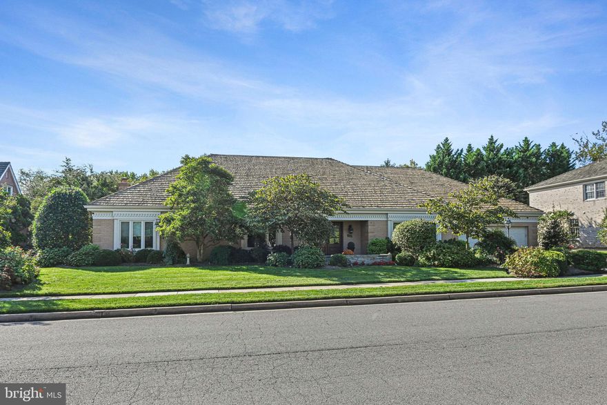 Located in the highly sought after Evermay neighborhood of McLean and within the Langley school pyramid, this beautifully maintained home offers spacious two level living with exceptional indoor and outdoor spaces designed for both everyday living and entertaining. The main level features gleaming hardwood floors, extensive built ins, elegant crown moldings, and three generously sized bedrooms.

A welcoming, sun filled foyer opens to the main living spaces, including a gracious Living Room with fireplace and a dedicated Dining Room. The open Kitchen offers ample counter space, a table area, and flows seamlessly into the expansive Family Room. Designed for year round enjoyment, the Family Room overlooks the backyard pool and features a game room area, built in bar, and a conveniently located full bathroom.

The spacious Primary Suite includes custom built ins, a sitting area, and a luxurious Primary Bathroom with soaking tub, walk in shower, heated floors, and two closets. Two additional main level bedrooms share a Jack and Jill bathroom and include extensive built ins. The main level also offers direct access to the two car garage, a laundry room, and a dedicated pantry.

The upper level provides flexible living space with two additional guest bedrooms, a full bathroom, and a large recreation room or additional Family Room. Abundant storage is found throughout the home.

The outdoor spaces are equally impressive with a fenced backyard pool, outdoor lighting, sprinkler system, and thoughtfully designed hardscape, creating a private setting ideal for entertaining or relaxing.

A wonderful opportunity to enjoy comfortable living in one of McLean’s most desirable neighborhoods.