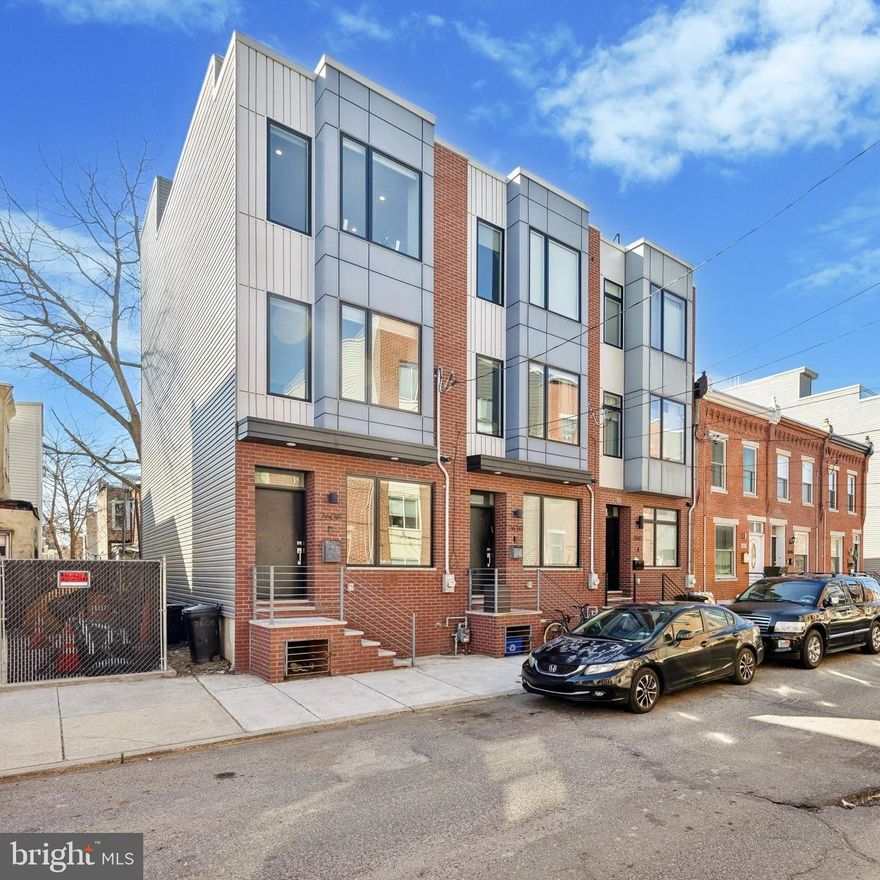 Welcome to 2608 Manton St., a stunning, nearly new 3-bedroom, 2.5-bathroom home in the rapidly growing Grays Ferry neighborhood. With 2,200 square feet of living space, a rooftop deck, and a finished basement, this home offers the perfect blend of style, space, and city convenience.
Step inside to find natural solid oak floors running throughout, accentuated by a custom steel open staircase that enhances the home’s bright and airy feel. The sleek, modern kitchen features white shaker cabinets, a large island, honed black granite countertops, and stainless steel appliances—ideal for cooking, entertaining, and gathering. Just beyond, a spacious backyard provides a rare outdoor retreat in the city. 
The second floor boasts two generously sized bedrooms, a full bathroom, and a convenient laundry room. The third floor is dedicated to the expansive primary suite, complete with a huge bedroom, walk-in closet, and a spa-like ensuite bath featuring an oversized shower, concrete porcelain tile, a 60" double vanity, and matte black Delta fixtures.
Atop it all, the roof deck delivers breathtaking panoramic views of the Center City skyline, making it the perfect spot for entertaining or unwinding under the stars. The finished basement with a half bath offers incredible flexibility—use it as a home gym, playroom, office, or additional living space.
This home is just minutes from Center City, CHOP, UPenn, Drexel, and the Schuylkill River Trail. The neighborhood is seeing exciting development and has easy access to I-76, public transit, and bike-friendly streets. Nearby parks, coffee shops, and local dining options make it a great place to call home.
With approximately five years left on the tax abatement, this is an incredible opportunity to own a modern home in a thriving Philly neighborhood. Don’t miss your chance to see it—schedule your showing today!