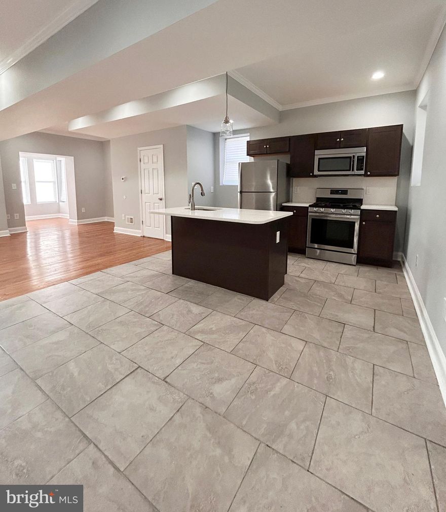 Welcome to 700 Richwood Avenue. This beautifully renovated 3 bedroom, 2.5 bathroom home is now available. The home features solid hardwood floors, recessed lighting, and baseboard molding throughout. The first floor has a spacious open concept layout  filled with natural light. The kitchen offers quartz countertops and stainless steel appliances including refrigerator, gas stove, dishwasher, and built-in microwave. Head to the second floor where you will find a bright and sunny primary bedroom with en suite bathroom, two additional bedrooms, a hallway bathroom, and a bonus room with access to a private deck. Additional features include off-street parking for 1 vehicle, a powder room on the first floor,  finished basement with W/D, and  newer HVAC system. Conveniently located near major roadways and local universities, this home provides an easy commute to all areas of the city. Don't miss this exceptional home- schedule your showing today!