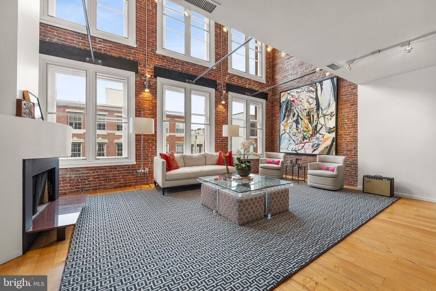 An art collector’s dream in the heart of Old City, the penthouse at 33 North 3rd Street offers a rare opportunity to own a true 19th-century warehouse reimagined for modern living at an extraordinary scale, complete with a private roof deck spanning over 1,400 square feet.

Originally constructed in 1853 and later used as a wool warehouse and leather tannery, the building’s industrial purpose is not just a detail, it is the defining feature of the home. The soaring ceilings, expansive walls, and dramatic proportions were built for storage and commerce, and today create a setting that feels purpose-built for a serious art collection or a buyer who values space, presence, and originality.

Spanning over 4,700 square feet across two levels, this two-bedroom, three-bath penthouse delivers a living experience that is almost impossible to replicate in Philadelphia. The scale is immediate and striking, anchored by a stunning glass atrium at the upper level that fills the home with natural light while thoughtfully preserving wall space below, an architectural feature that is as functional as it is visually dramatic.

The layout remains highly functional, with private elevator access via secure code to both floors, offering ease of living and flexibility for a range of lifestyles. The second level presents additional opportunities for customization, whether as expanded living space, workspace, or potential additional sleeping quarters.

What sets this home apart is its authenticity. Nothing here is artificial or forced. The architecture is real, the proportions are intentional, and the character has been earned over time. It is a space that carries a distinct energy, one that resonates immediately with the right buyer.

The primary suite offers a quieter, more refined counterpoint to the dramatic main living spaces, featuring a spacious walk-in closet, a well-appointed laundry area, and a spa-like bath complete with a steam shower. Along the main level, extensive built-in storage runs nearly the full length of the home, a rare and highly practical complement to the open loft design.

A true extension of the home, the private roof deck spans over 1,400 square feet and delivers sweeping 270-degree views of the Philadelphia skyline. It is a rare outdoor space of this scale, offering endless potential for entertaining, relaxing, or creating a one-of-a-kind urban retreat.

There is a true downtown loft sensibility throughout, reminiscent of New York’s most compelling conversions, yet with a level of square footage and value that is increasingly rare. Positioned at the top of a historic Old City building, the penthouse offers both presence and privacy, surrounded by some of Philadelphia’s best architecture, galleries, and restaurants. For added convenience, the seller is offering two years of two-car parking located directly adjacent to the building with an acceptable offer.

This is not a typical condominium, and it is not meant to be. For the buyer who has outgrown the expected and is searching for something with scale, soul, and lasting impact, this penthouse stands in a category of its own.