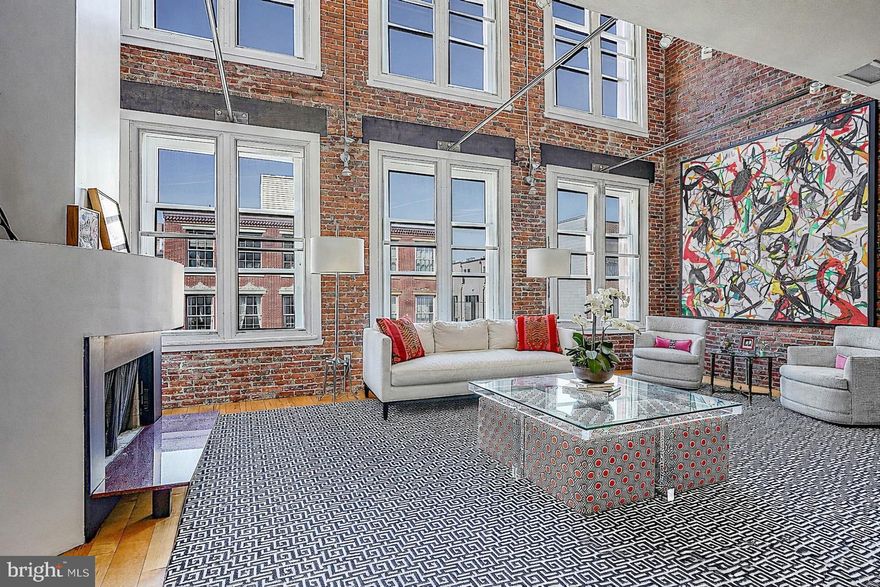 An art collector’s dream in the heart of Old City, the penthouse at 33 North 3rd Street offers a rare opportunity to own a true 19th-century warehouse reimagined for modern living at an extraordinary scale, complete with a private roof deck spanning over 1,400 square feet.

Originally constructed in 1853 and later used as a wool warehouse and leather tannery, the building’s industrial purpose is not just a detail, it is the defining feature of the home. The soaring ceilings, expansive walls, and dramatic proportions were built for storage and commerce, and today create a setting that feels purpose-built for a serious art collection or a buyer who values space, presence, and originality.

Spanning over 4,700 square feet across two levels, this two-bedroom, three-bath penthouse delivers a living experience that is almost impossible to replicate in Philadelphia. The scale is immediate and striking, anchored by a stunning glass atrium at the upper level that fills the home with natural light while thoughtfully preserving wall space below, an architectural feature that is as functional as it is visually dramatic.

The layout remains highly functional, with private elevator access via secure code to both floors, offering ease of living and flexibility for a range of lifestyles. The second level presents additional opportunities for customization, whether as expanded living space, workspace, or potential additional sleeping quarters.

What sets this home apart is its authenticity. Nothing here is artificial or forced. The architecture is real, the proportions are intentional, and the character has been earned over time. It is a space that carries a distinct energy, one that resonates immediately with the right buyer.

The primary suite offers a quieter, more refined counterpoint to the dramatic main living spaces, featuring a spacious walk-in closet, a well-appointed laundry area, and a spa-like bath complete with a steam shower. Along the main level, extensive built-in storage runs nearly the full length of the home, a rare and highly practical complement to the open loft design.

A true extension of the home, the private roof deck spans over 1,400 square feet and delivers sweeping 270-degree views of the Philadelphia skyline. It is a rare outdoor space of this scale, offering endless potential for entertaining, relaxing, or creating a one-of-a-kind urban retreat.

There is a true downtown loft sensibility throughout, reminiscent of New York’s most compelling conversions, yet with a level of square footage and value that is increasingly rare. Positioned at the top of a historic Old City building, the penthouse offers both presence and privacy, surrounded by some of Philadelphia’s best architecture, galleries, and restaurants. For added convenience, the seller is offering two years of two-car parking located directly adjacent to the building with an acceptable offer.

This is not a typical condominium, and it is not meant to be. For the buyer who has outgrown the expected and is searching for something with scale, soul, and lasting impact, this penthouse stands in a category of its own.