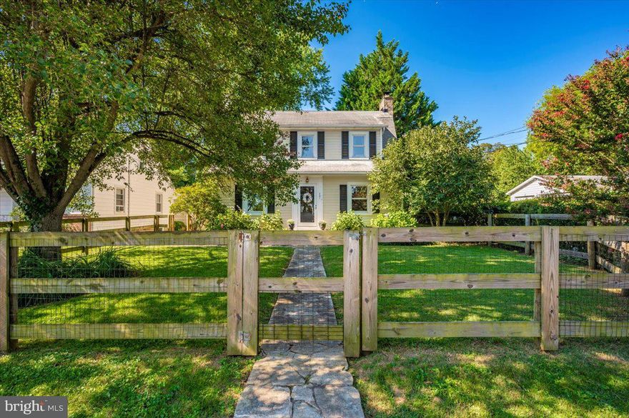 Welcome to this charming home, perfectly situated within walking distance to the delightful Downtown Sykesville! Step inside through the stained-glass front door and be captivated by the hardwood floors, staircase, moldings, and doors. The main floor boasts a large living room with a wood-burning fireplace, and a formal dining room featuring crown molding and chair rail. These rooms retain their old-world charm with built-in wood shutters. The eat-in kitchen offers ample 42" cabinets, including drawers and a pantry, a propane gas range, large windows, and a breakfast nook overlooking the garden boxes in the backyard. A convenient powder room with a pedestal sink and medicine cabinet is located off the kitchen. Before heading upstairs, you'll find an office or potential 4th bedroom.  Upstairs, discover three bedrooms and a full bath with a shower/tub combo featuring ceramic tile surround, plus an extra nook for towels, laundry, and more. The hallway linen closet provides deep shelving. All bedrooms have overhead lighting. Bedroom 2 features a large closet with shelving.
The 28' x 21' unfinished basement provides extensive storage with numerous cabinets and 18' of workshop countertop space, a laundry area, and an exit to the backyard. The home features updated electric, 200 amps. Double-hung/tilt-in replacement windows are installed throughout.
Relax on the 15' x 13' brick paver patio, complete with an ivy-covered pergola – the perfect spot for reading or enjoying the outdoors. The beautiful landscaping includes Crepe Myrtle trees and bushes, Hosta, Hydrangea, Rhododendron bushes, various grasses and ground cover, Ivy and more! A shed out back next to your off-street parking accommodates at least four cars.  You DO NOT want to miss this one!!! Call you favorite Realtor for a tour today!!