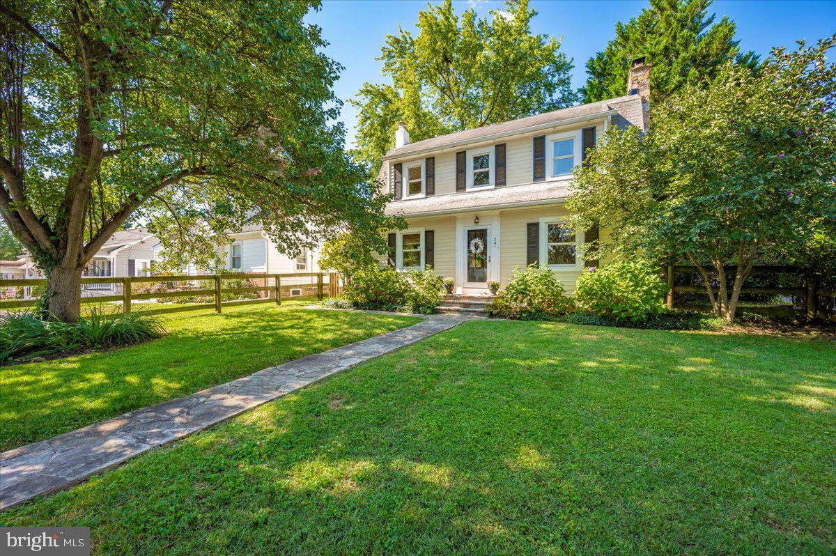 Welcome to this charming home, perfectly situated within walking distance to the delightful Downtown Sykesville! Step inside through the stained-glass front door and be captivated by the hardwood floors, staircase, moldings, and doors. The main floor boasts a large living room with a wood-burning fireplace, and a formal dining room featuring crown molding and chair rail. These rooms retain their old-world charm with built-in wood shutters. The eat-in kitchen offers ample 42" cabinets, including drawers and a pantry, a propane gas range, large windows, and a breakfast nook overlooking the garden boxes in the backyard. A convenient powder room with a pedestal sink and medicine cabinet is located off the kitchen. Before heading upstairs, you'll find an office or potential 4th bedroom. Upstairs, discover three bedrooms and a full bath with a shower/tub combo featuring ceramic tile surround, plus an extra nook for towels, laundry, and more. The hallway linen closet provides deep shelving. All bedrooms have overhead lighting. Bedroom 2 features a large closet with shelving.
The 28' x 21' unfinished basement provides extensive storage with numerous cabinets and 18' of workshop countertop space, a laundry area, and an exit to the backyard. The home features updated electric, 200 amps. Double-hung/tilt-in replacement windows are installed throughout.
Relax on the 15' x 13' brick paver patio, complete with an ivy-covered pergola – the perfect spot for reading or enjoying the outdoors. The beautiful landscaping includes Crepe Myrtle trees and bushes, Hosta, Hydrangea, Rhododendron bushes, various grasses and ground cover, Ivy and more! A shed out back next to your off-street parking accommodates at least four cars. You DO NOT want to miss this one!!! Call you favorite Realtor for a tour today!!