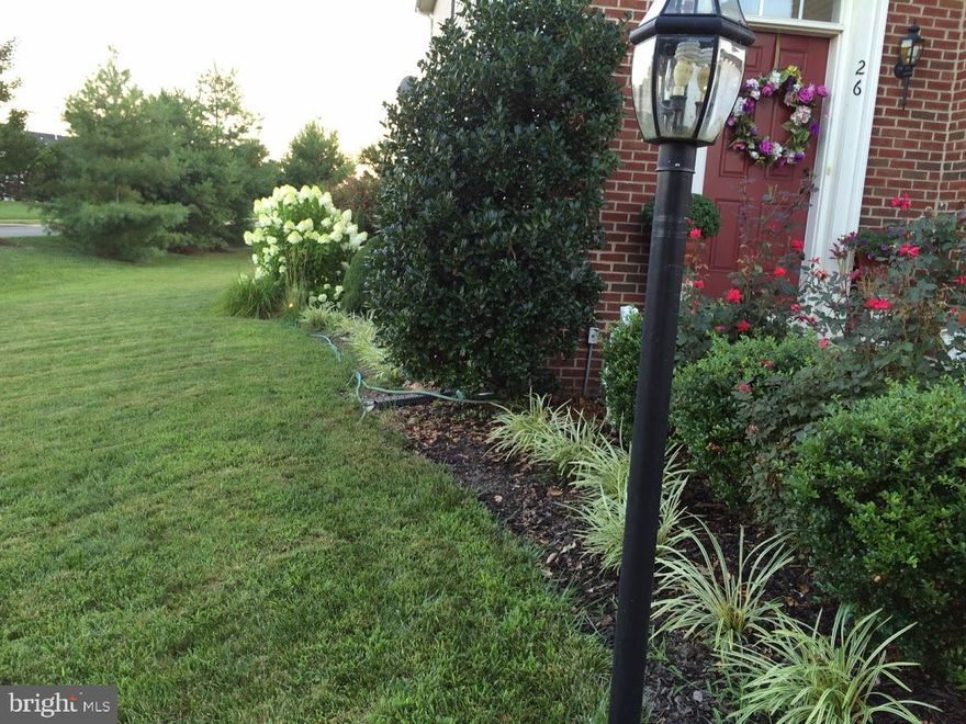 WoodStream Community***Walking distance to Commuter lot***Minutes to 95***Walking distance to Major shopping and eating areas***Quantico Military Base**** Brick front single family home w/2 car garage, private corner lot with a nice patio and walk up from the basement level.  This home features, 3 levels, 4 Bedrooms, 3.5 Baths a gourmet cooker's kitchen with gas stove granite, and stainless steel.  Total of 2726 living square feet on the top 2 levels.  Palatial Master suite with his/hers closets, soaker tub and separate shower.  This is a very walkable community with a playground nearby and a community center across the street.  The large basement offers space for e-learning!