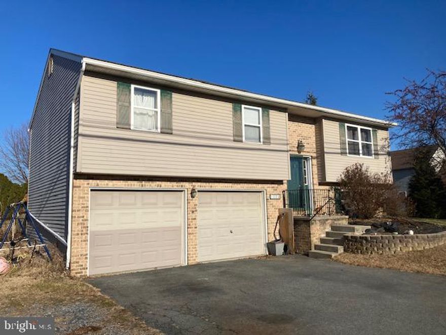 THIS PROPERTY IS GOING TO AUCTION ON THURSDAY FEBRUARY 12, 2026 @ 4:00 PM. THE LIST PRICE ONLY REFLECTS THE SUGGESTED STARTING BID. Spacious bi-level home in need of some cosmetic TLC located in a great rural setting on a nice level lot with fenced backyard, garden area, and deck. Main floor features a modern Oak cabinetry kitchen, dining room with patio doors leading to rear deck, living room with bay window, 3 bedrooms and Jack & Jill bathroom. Lower level offers an unfinished family room, full bathroom, and attached 2-bay garage with laundry hook-ups. Excellent starter home or valuable rental/investment property in desirable Garden Spot School District.